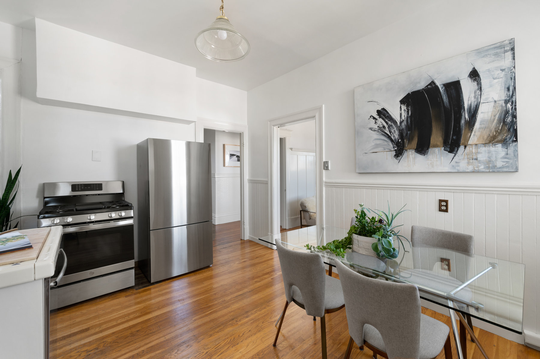 Kitchen has new stainless stove and fridge.