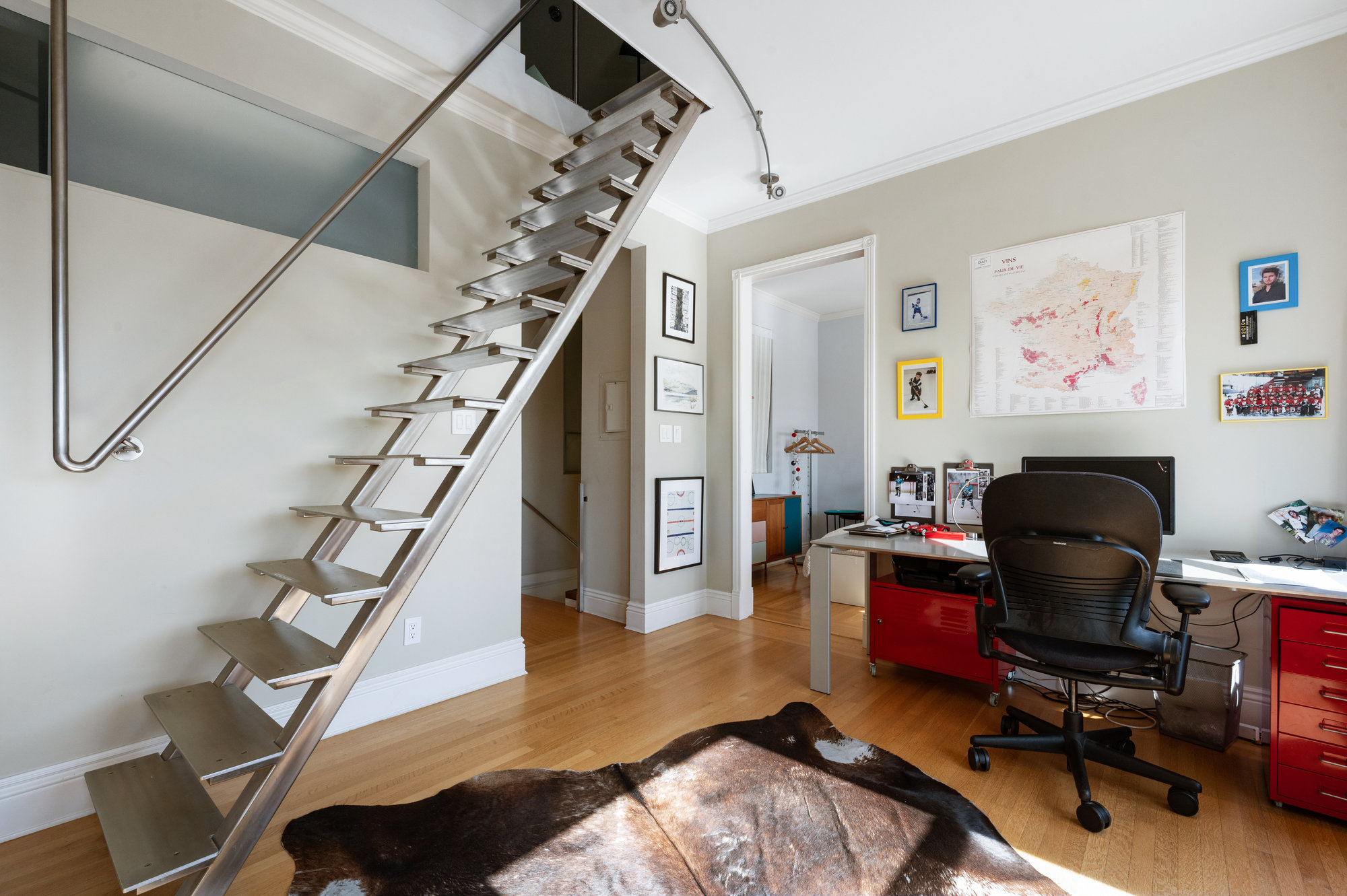 Metal steps and railing leading up from the office
