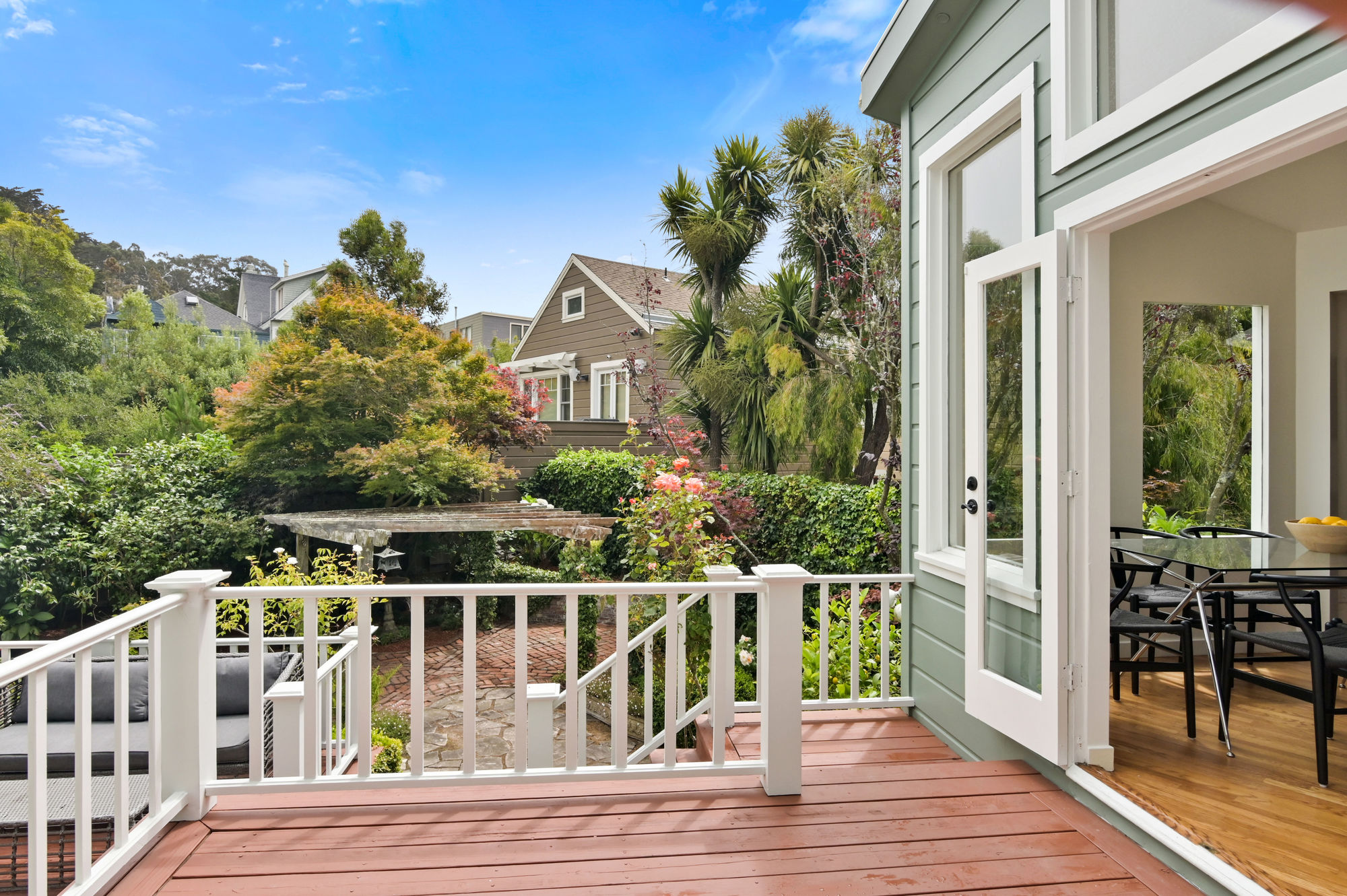 Deck overlooking a lush, green yard