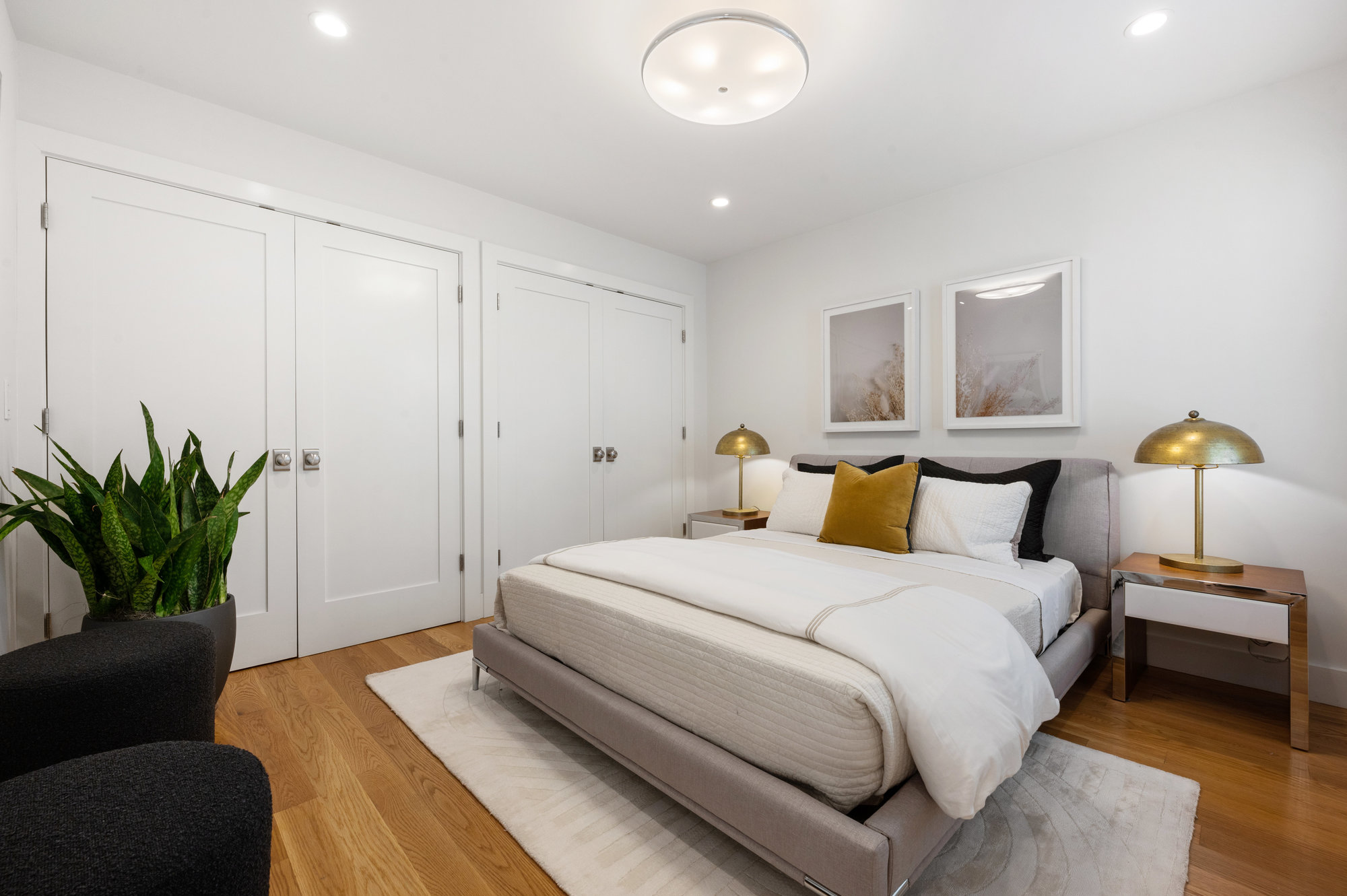 Bedroom four, showing large double closets and wood floors