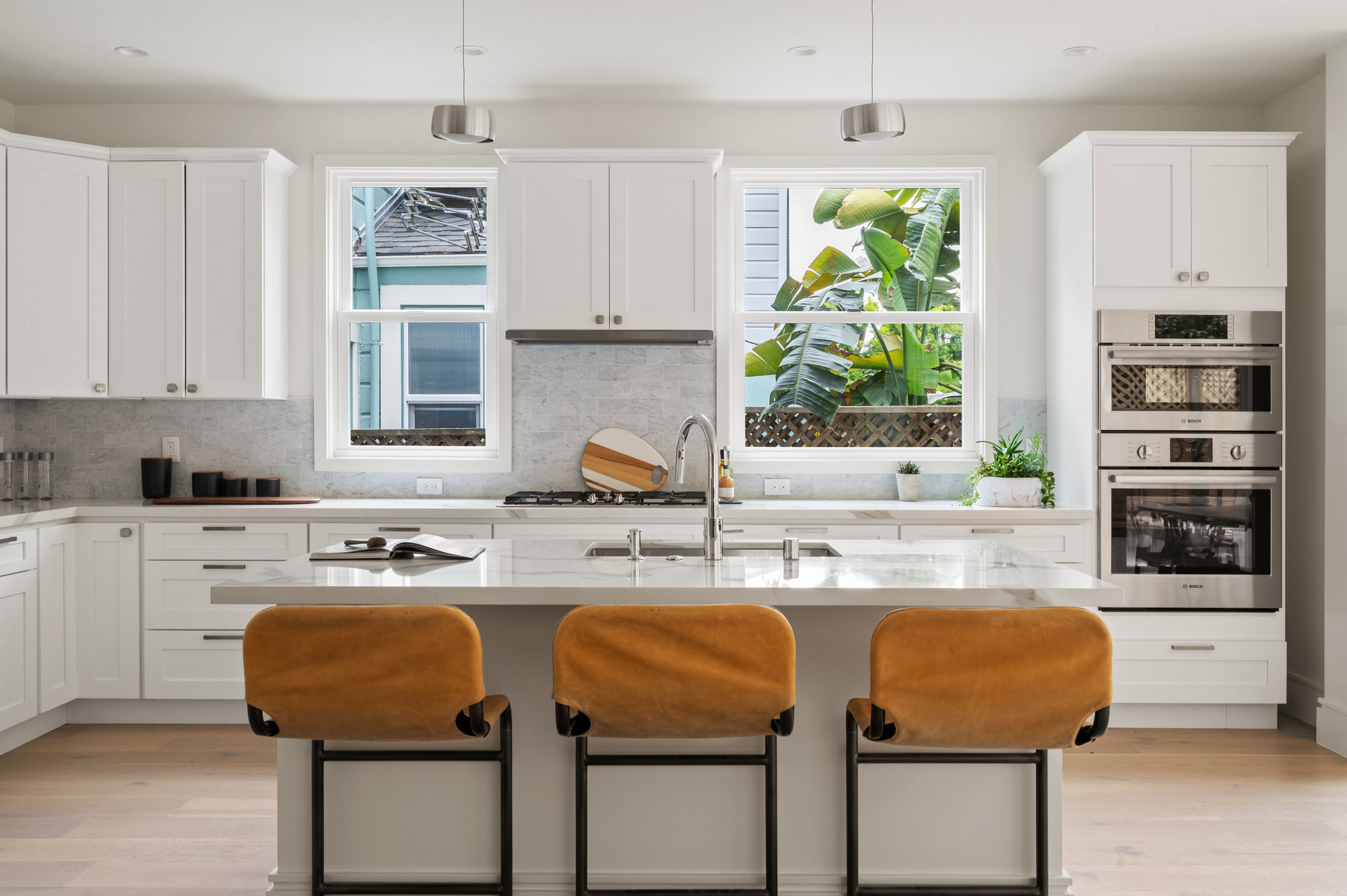 There is a window on both sides of sink that lets in lots of light. There are also all stainless steal appliances.