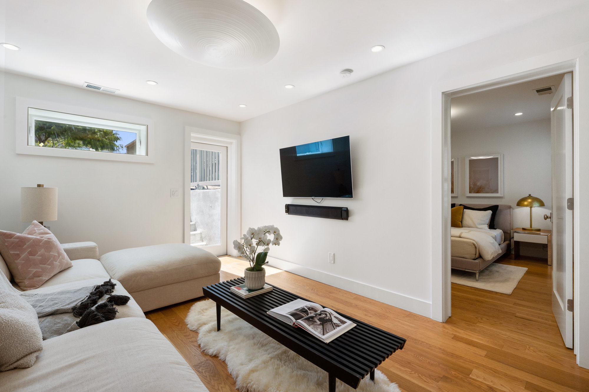 View of the lower living area and adjoining bedroom