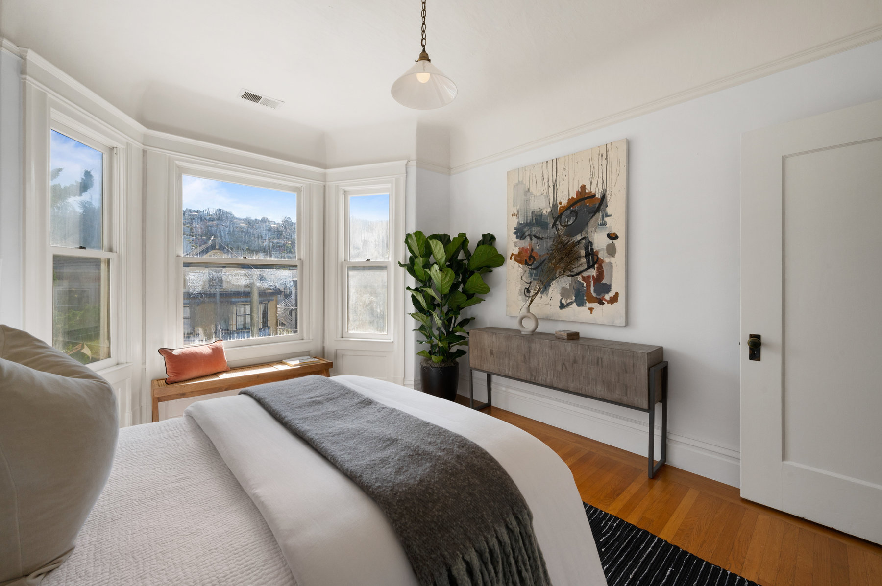 Guest bedroom in front of unit. Has bay windows that look out to Parnassus Ave.
