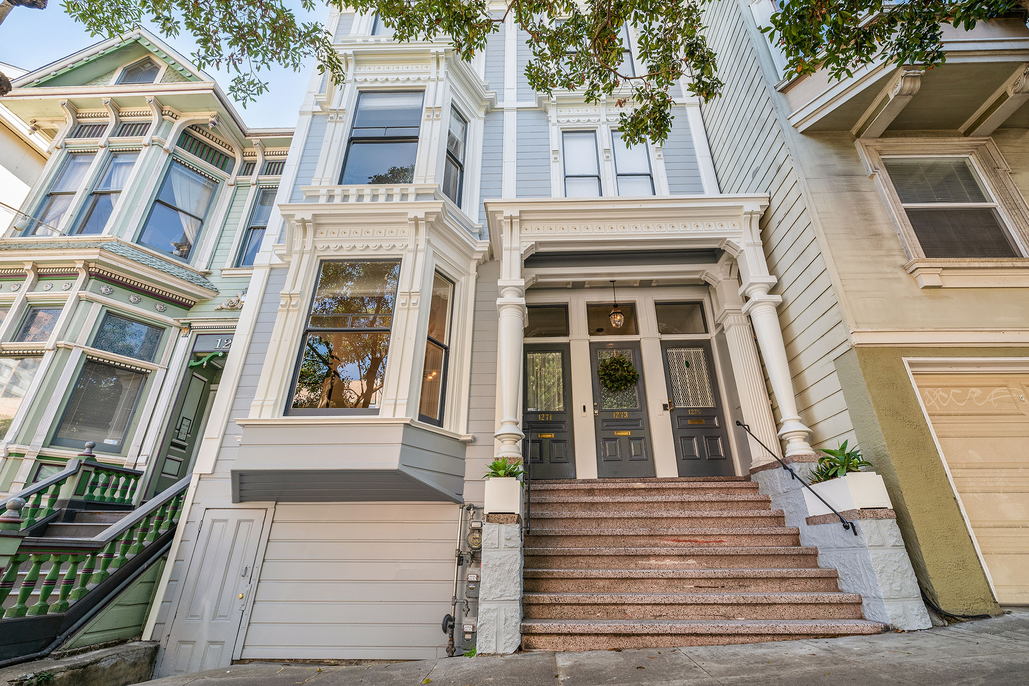 04 Close-up front exterior view of 1271 McAllister Street, showing the steps and front doors