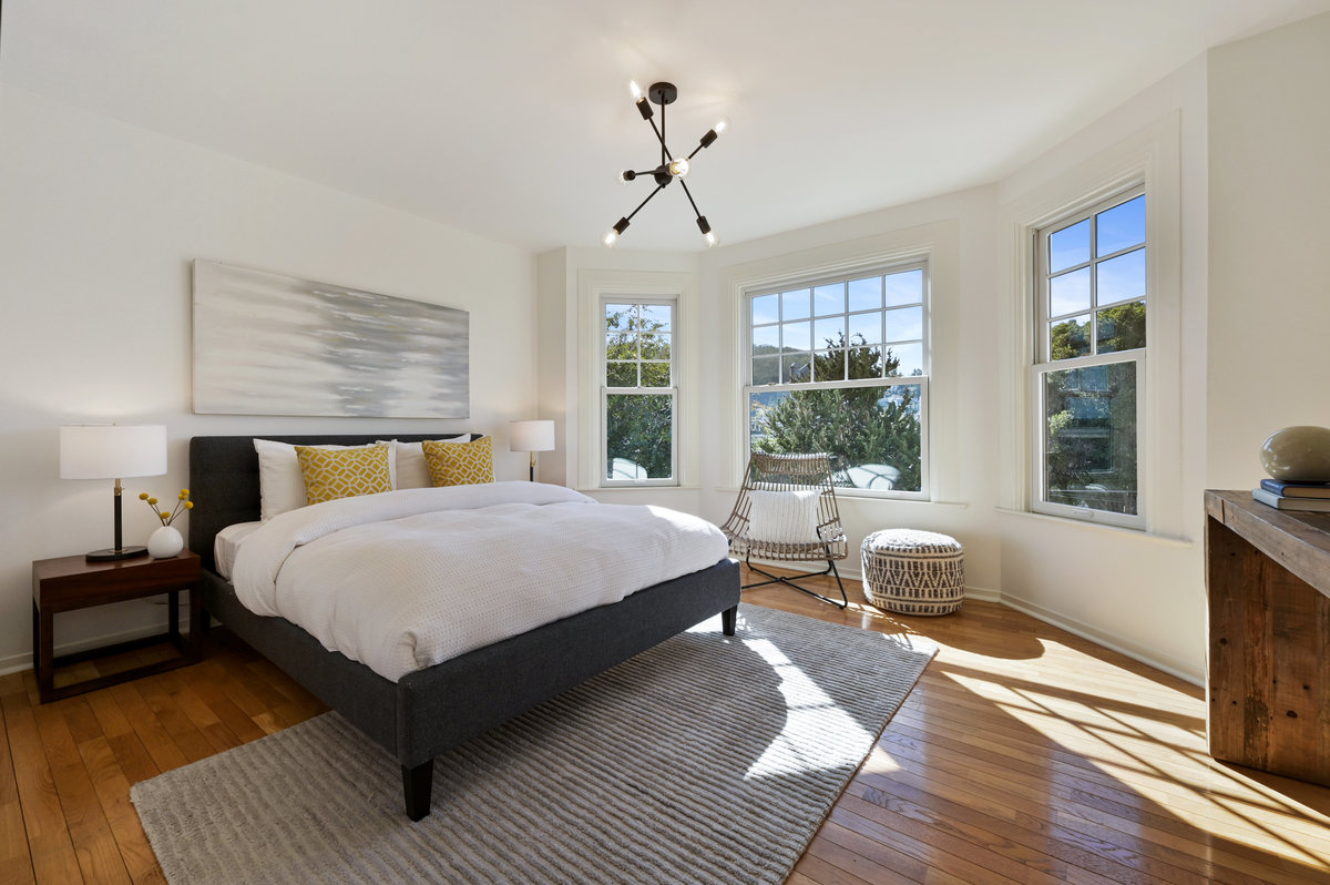 040068 Bedroom two, featuring three large bay windows