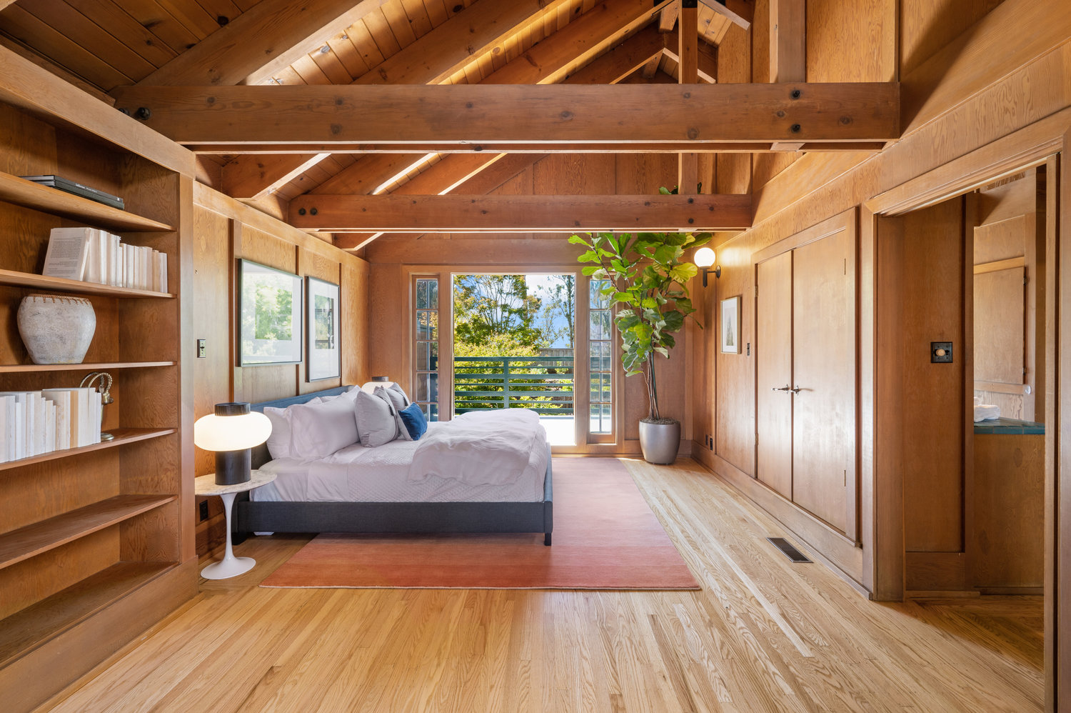 View of a large primary suite with walkout balcony