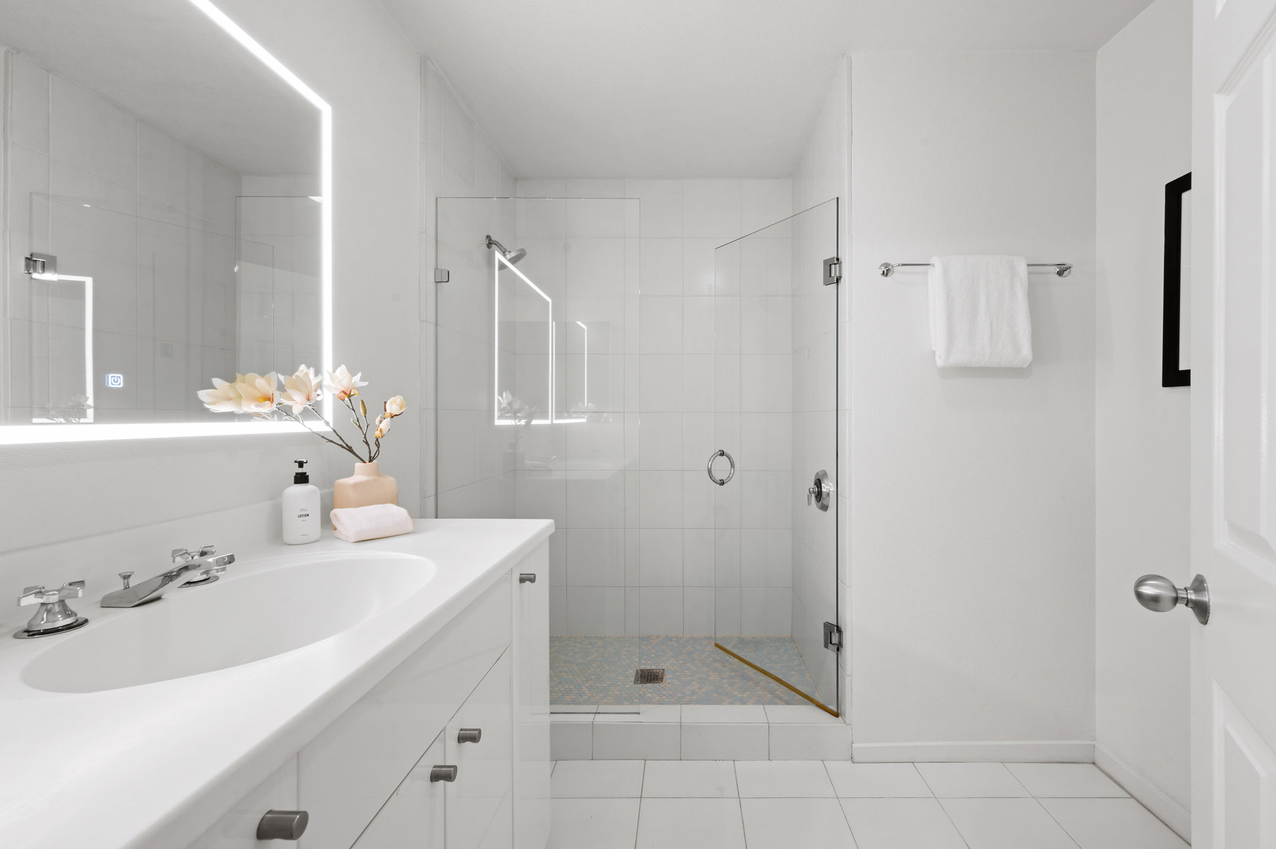 Primary bathroom has large shower.