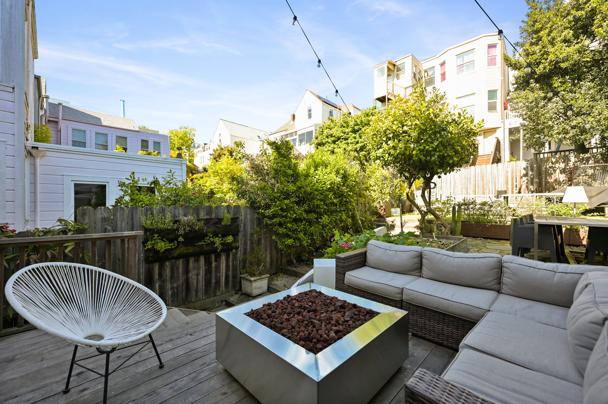 Outdoor living space with a wood deck area and yard beyond