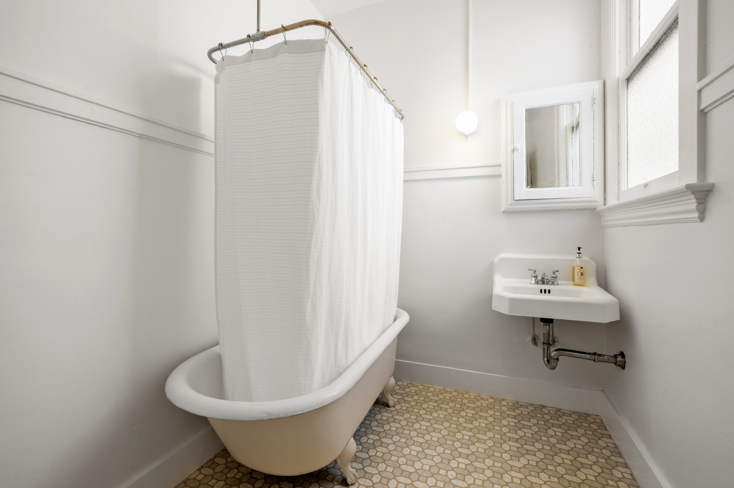 Bathroom with free-standing clawfoot bath tub