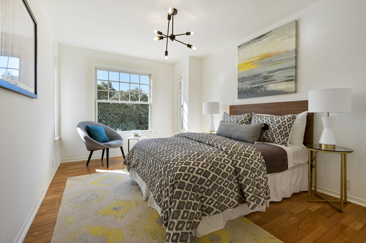 043074 View of bedroom three, featuring a large window