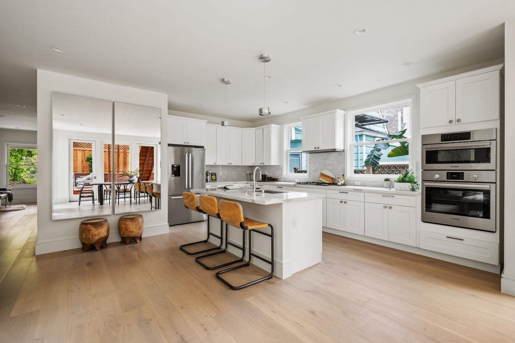 Looking into kitchen from dining space. Large open space.