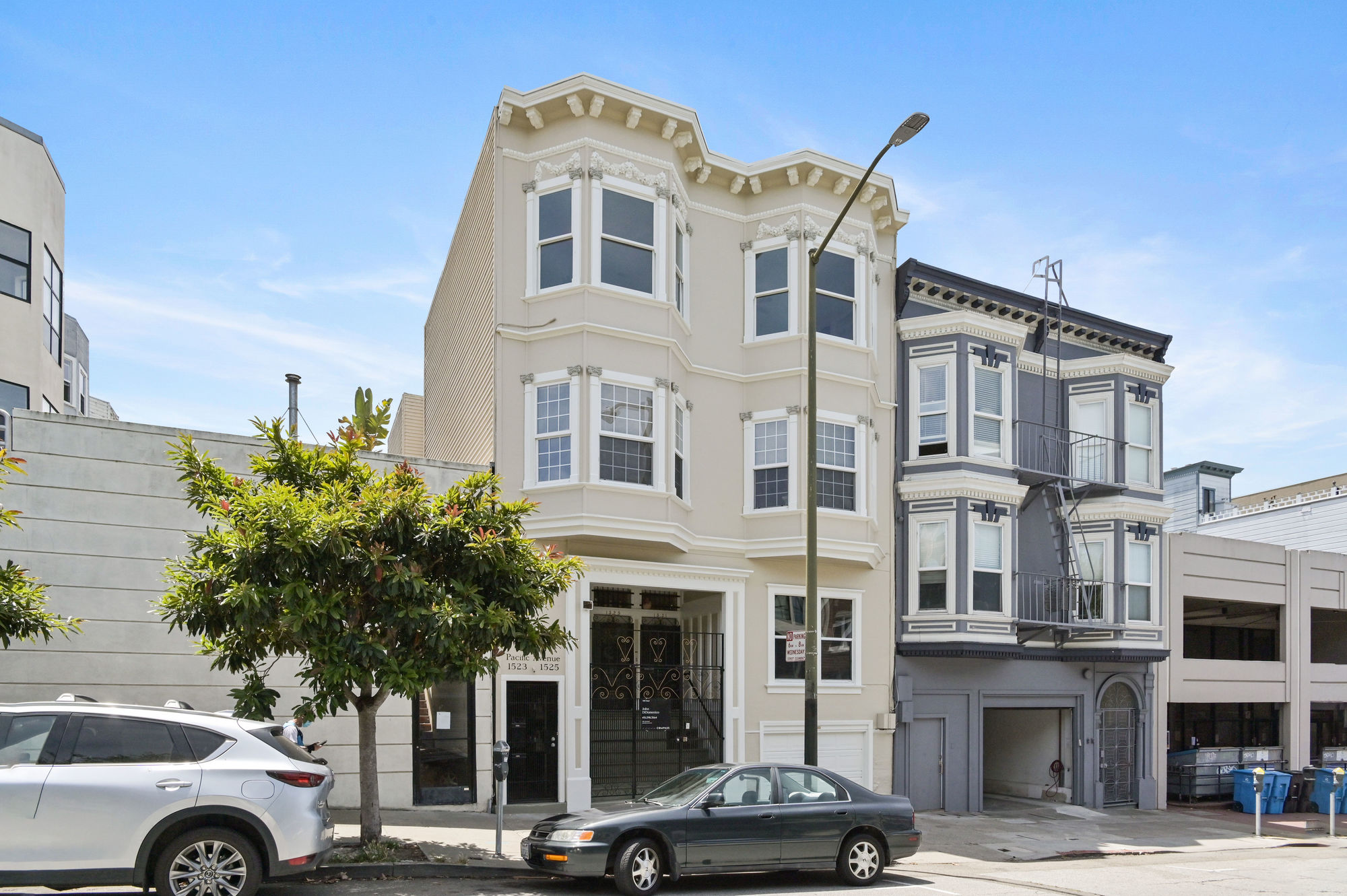 Front exterior view of 1527 Pacific Avenue, showing a light tan facade