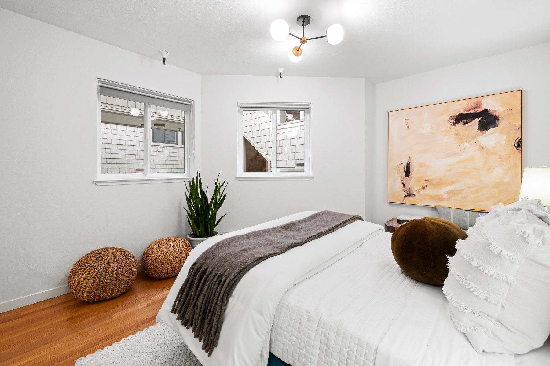 Guest room looking over full size bed.