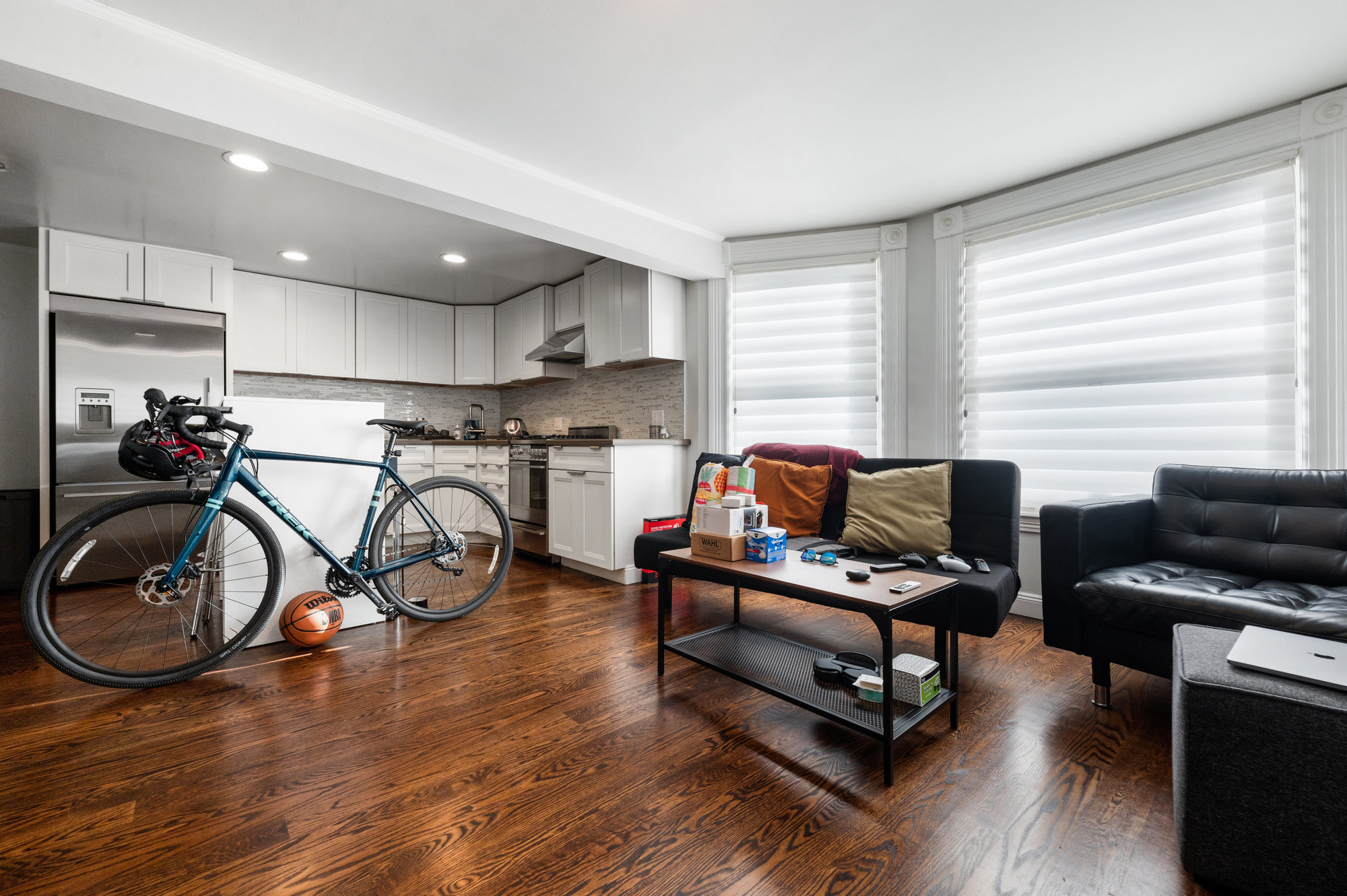 View of the living area within the in-law suite, showing a large living room and kitchen