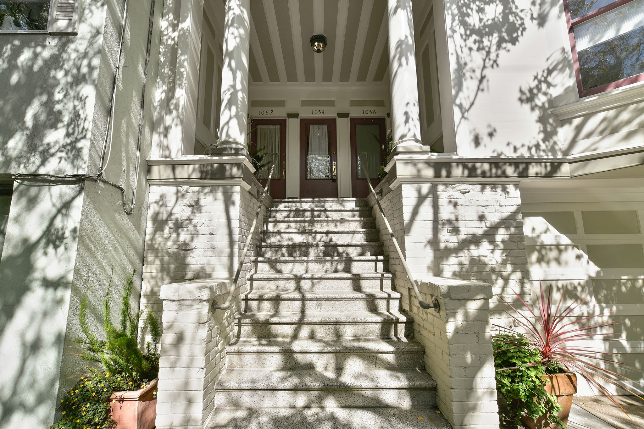 View of the front exterior steps leading up to 1052 Cole Street