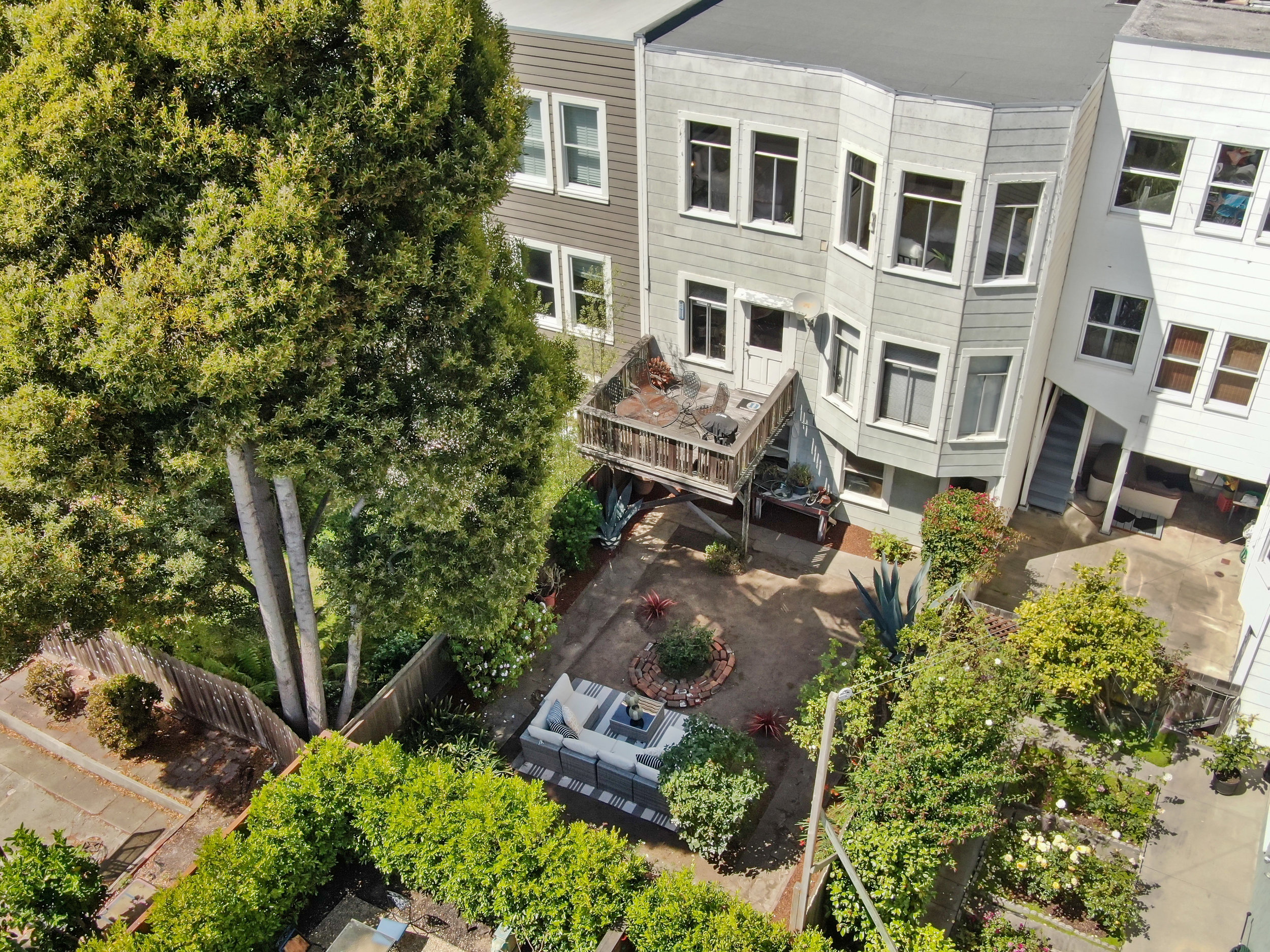 Aerial view of 637-639 Lake Street, looking down at the expansive back yard and deck