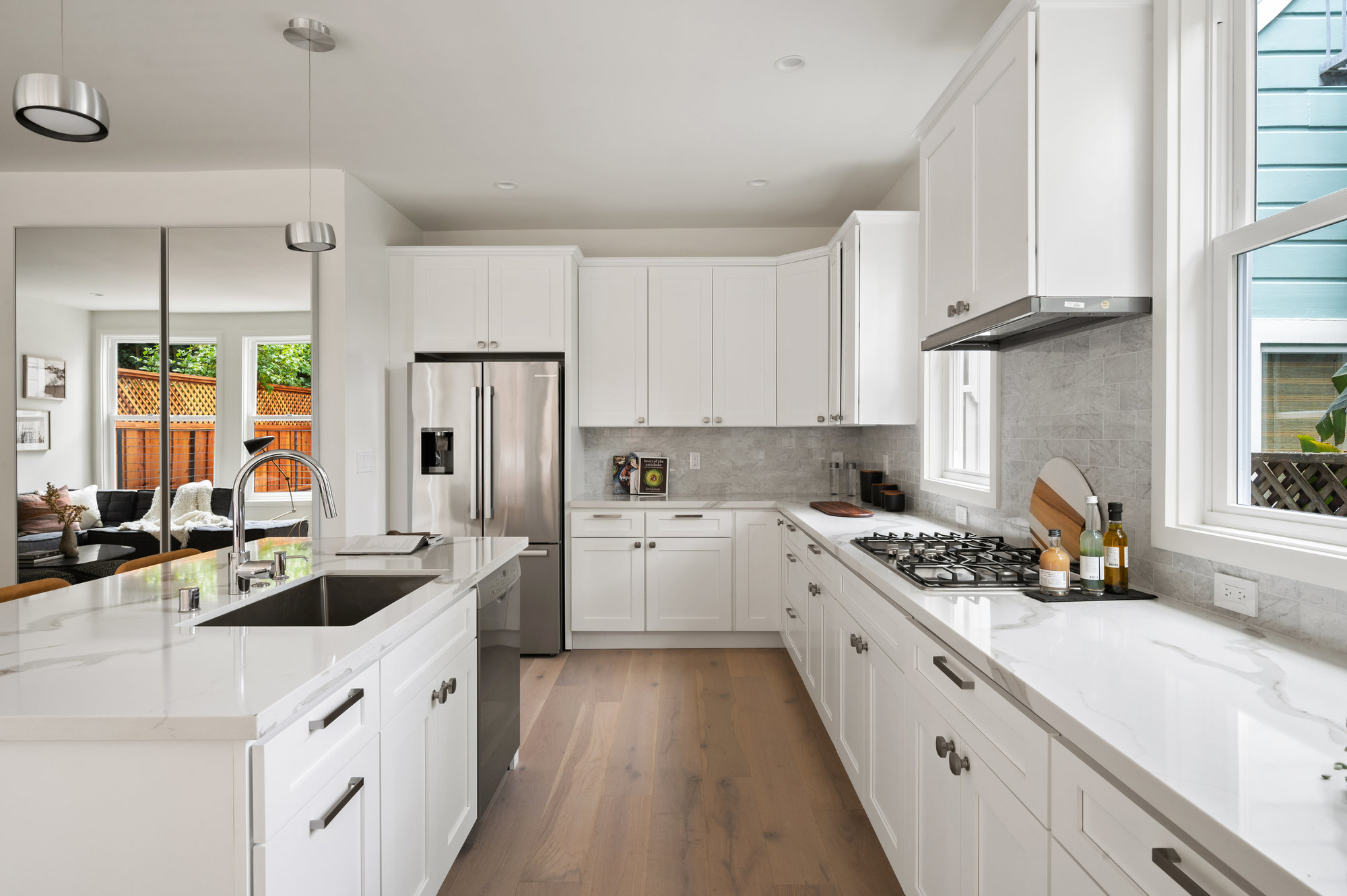 Looking down between the island and counter.  The sink and dishwasher are in/on island. There are also lower cabinets.