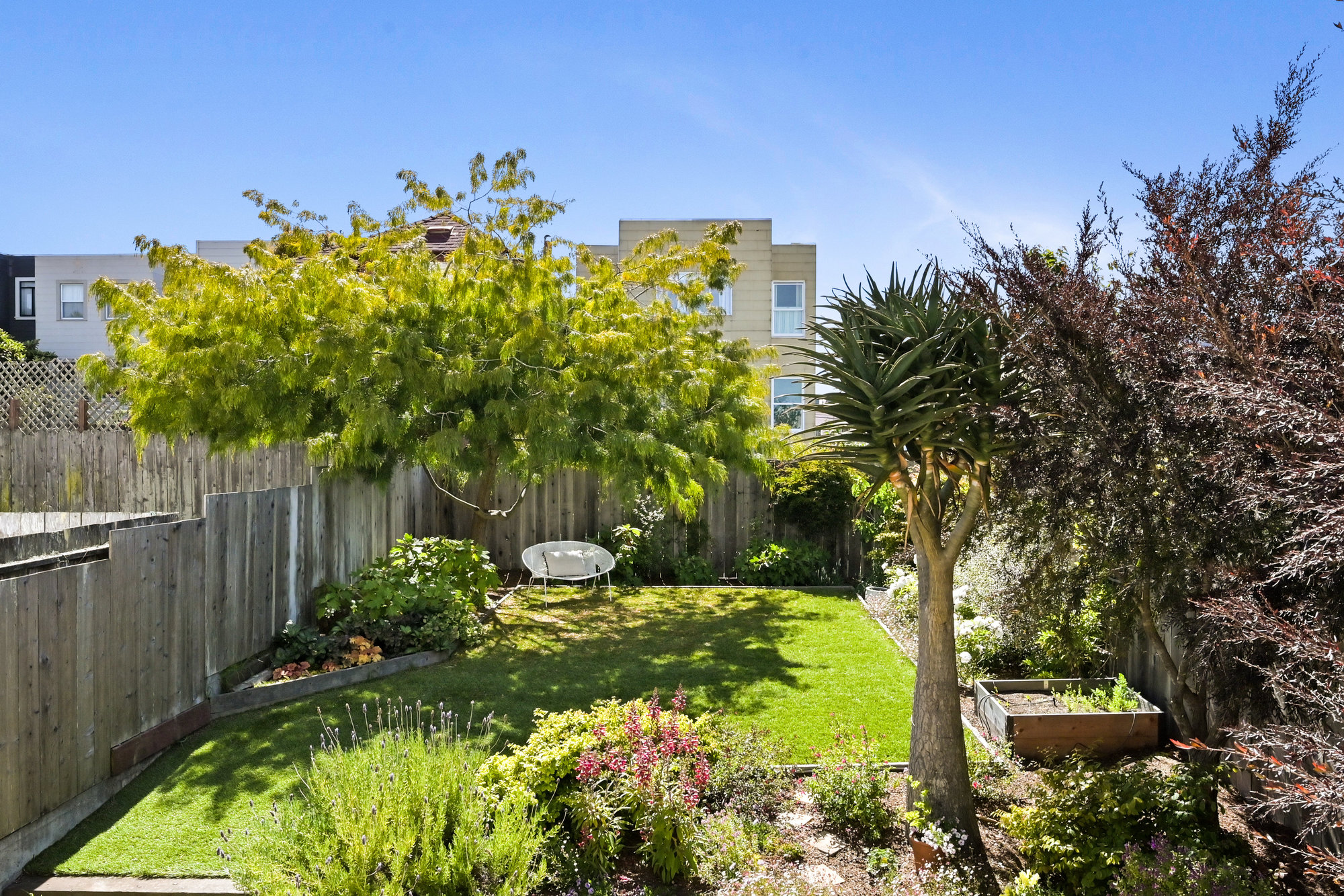 Expansive yard with excellent landscaping and outdoor living space