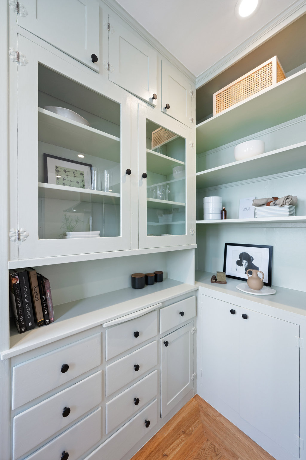 Close up of built in cabinet and it is painted a light mint green for an accent.