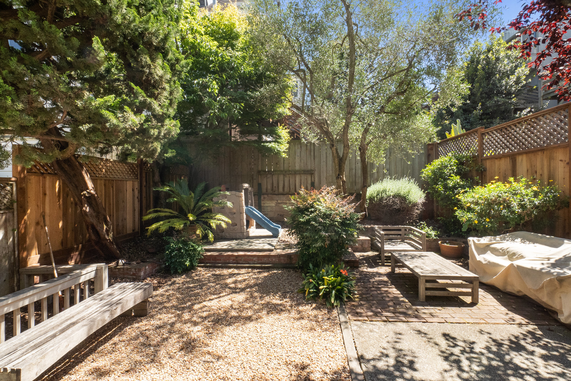 052063 Outdoor living space, showing a play area and sitting area