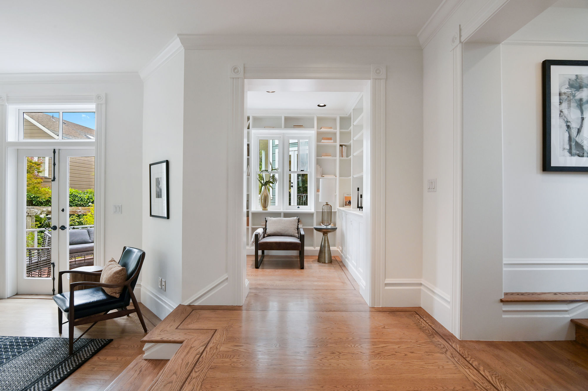 View of a cozy library with wood floors
