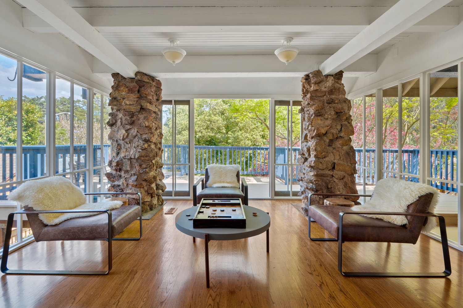 053photos281edgewood029 Sitting area that is surrounded by glass windows and french doors that open out to deck.
