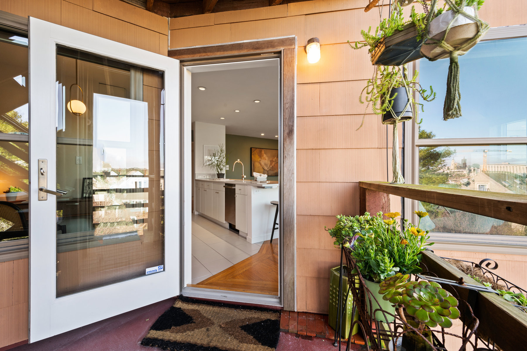 Photo of the back door and rear deck/stairways.