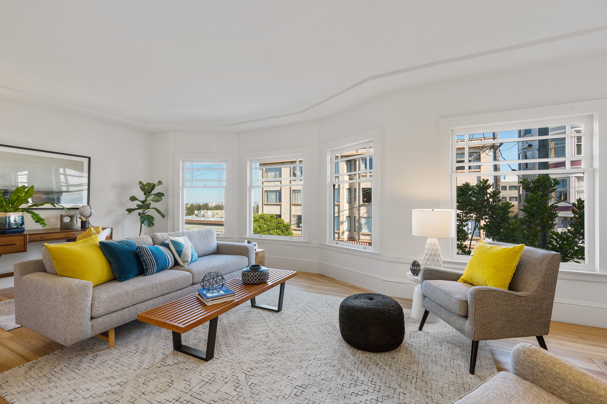 Living room with large windows and wood floors