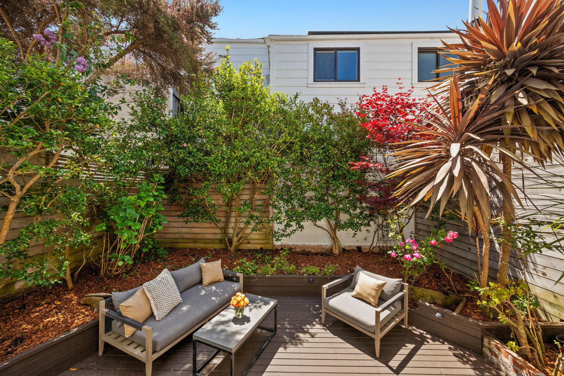 060photos1604castro059712 Back yard has lots of greenery and deck.