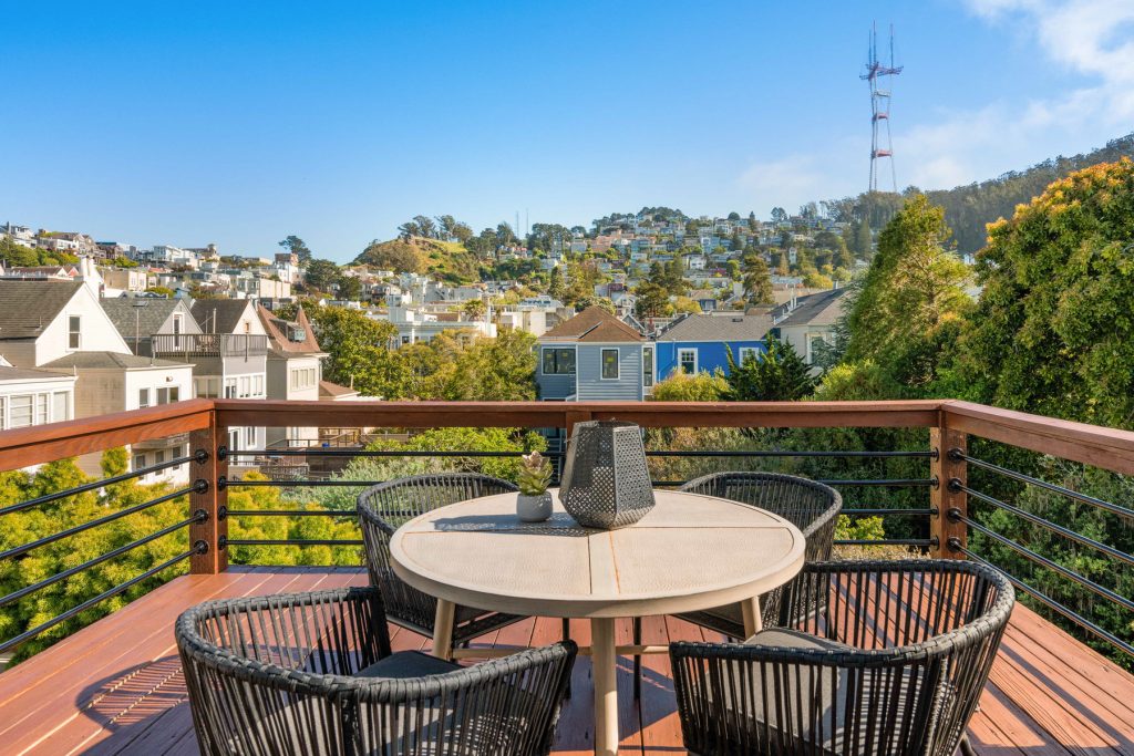 Deck off the back of unit with small table and beautiful views up to Sutro Tower.