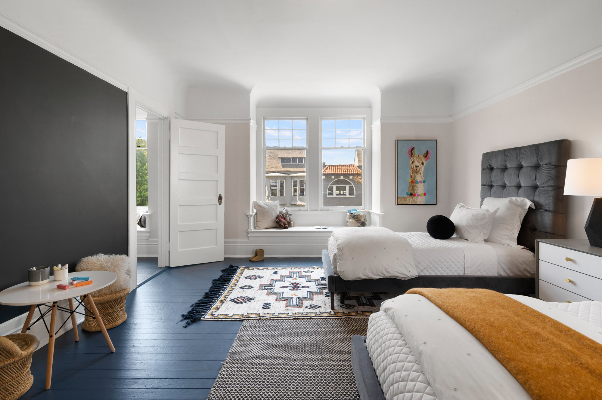 Bedroom two, with large windows with built-in seats