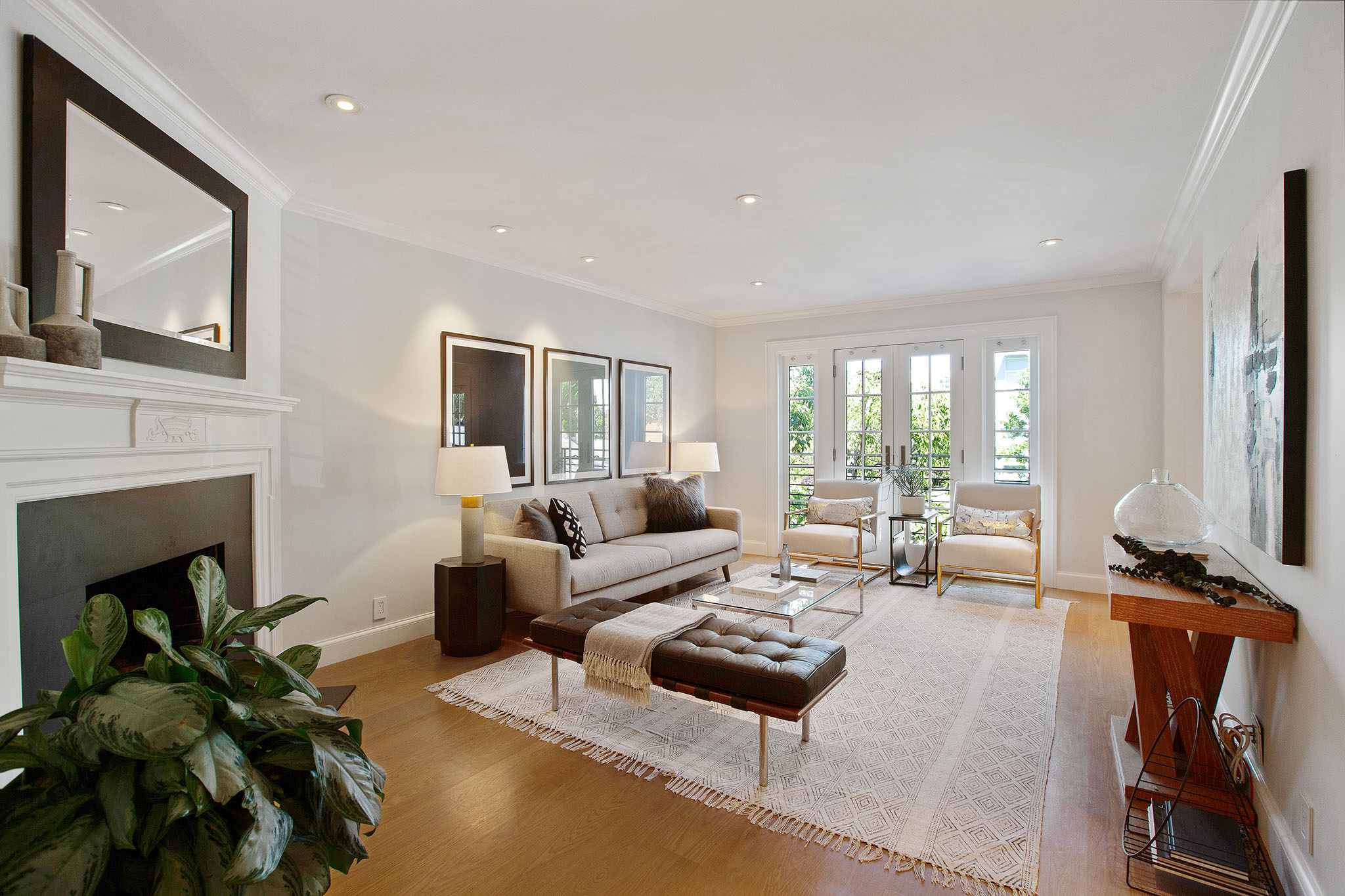 Main living space. There is a fireplace to the left and couch with two end tables and coffee table in the center of the room.