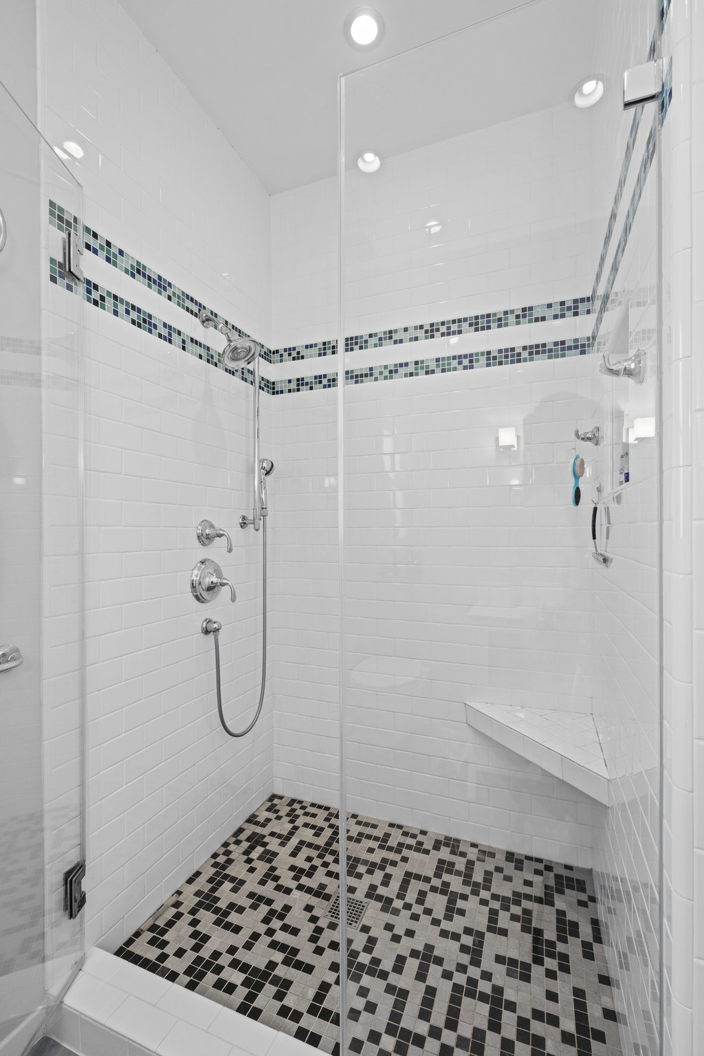 072photos36alma125955 Photo of the shower in primary bathroom. It is all tile with glass door.