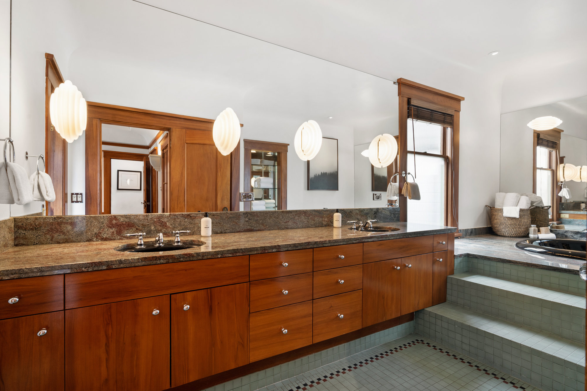 Bathroom with large double vanity and tub
