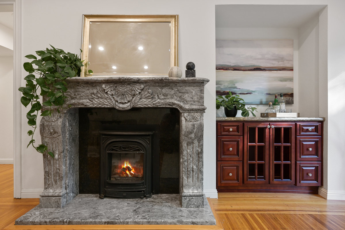 077120-vs2 Close-up of a fireplace with grey mantle