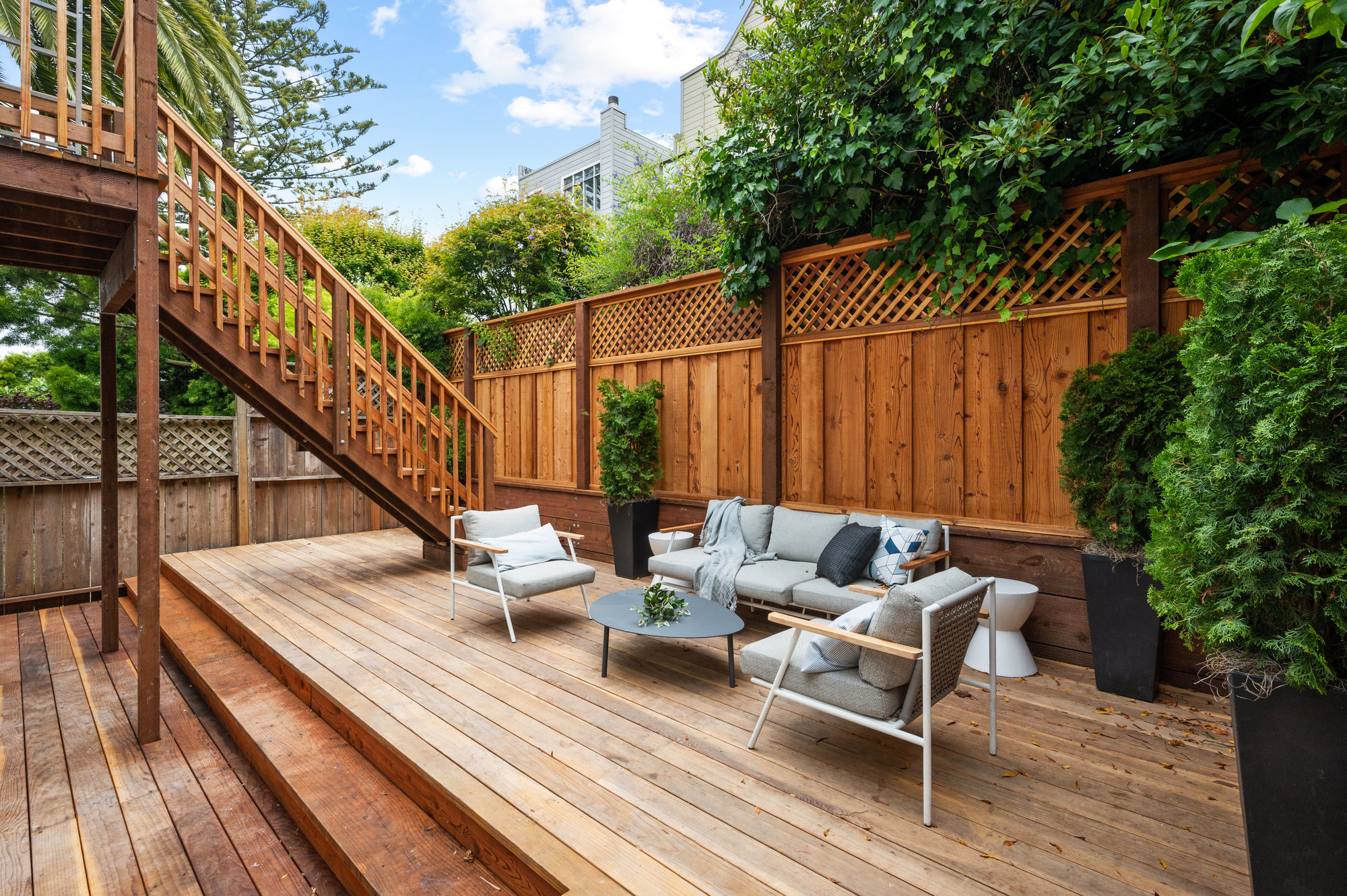 There is a sitting area on deck that has couch, 2 sitting chairs and small coffee table