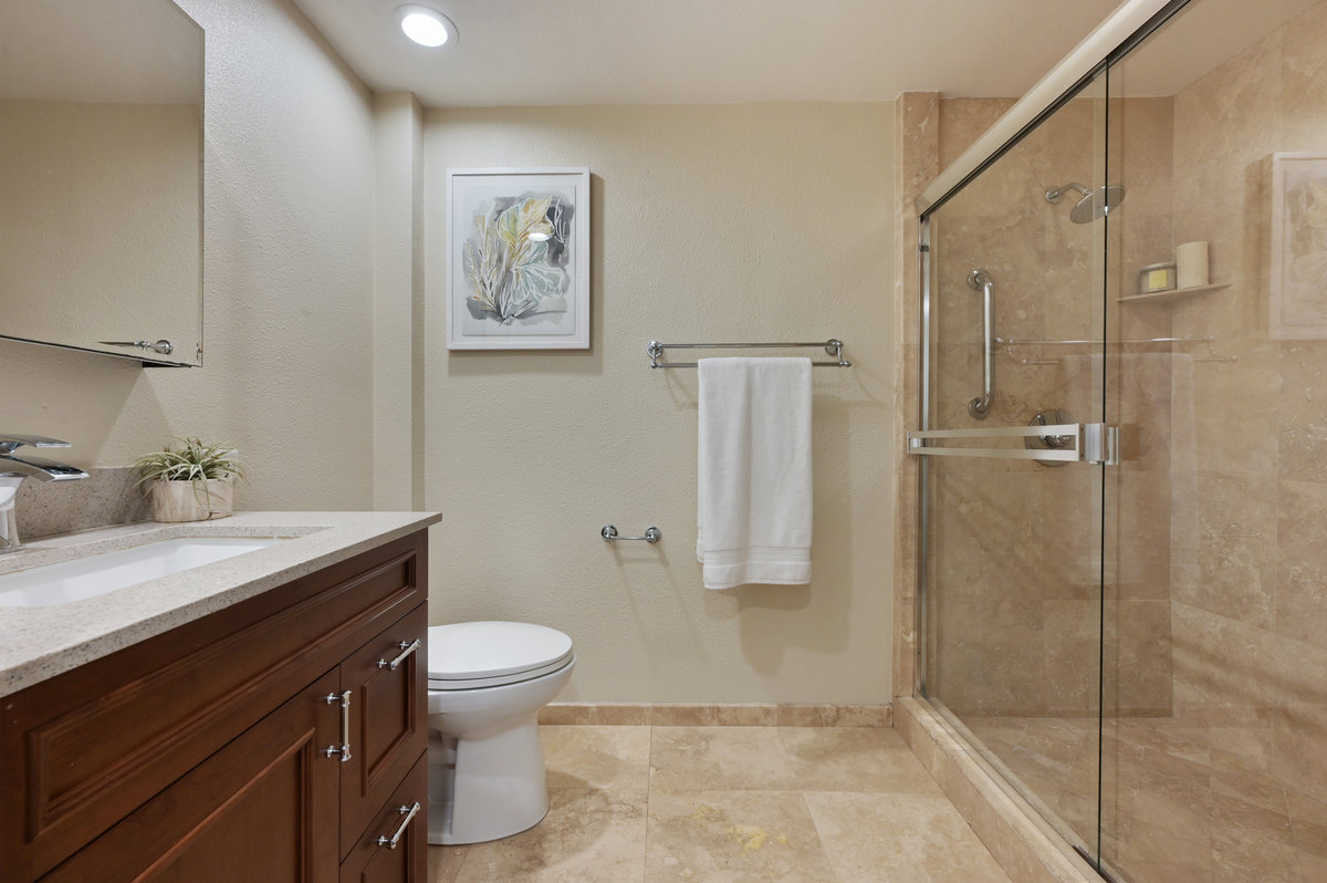 081126 Lower unit bathroom, featuring a glass shower
