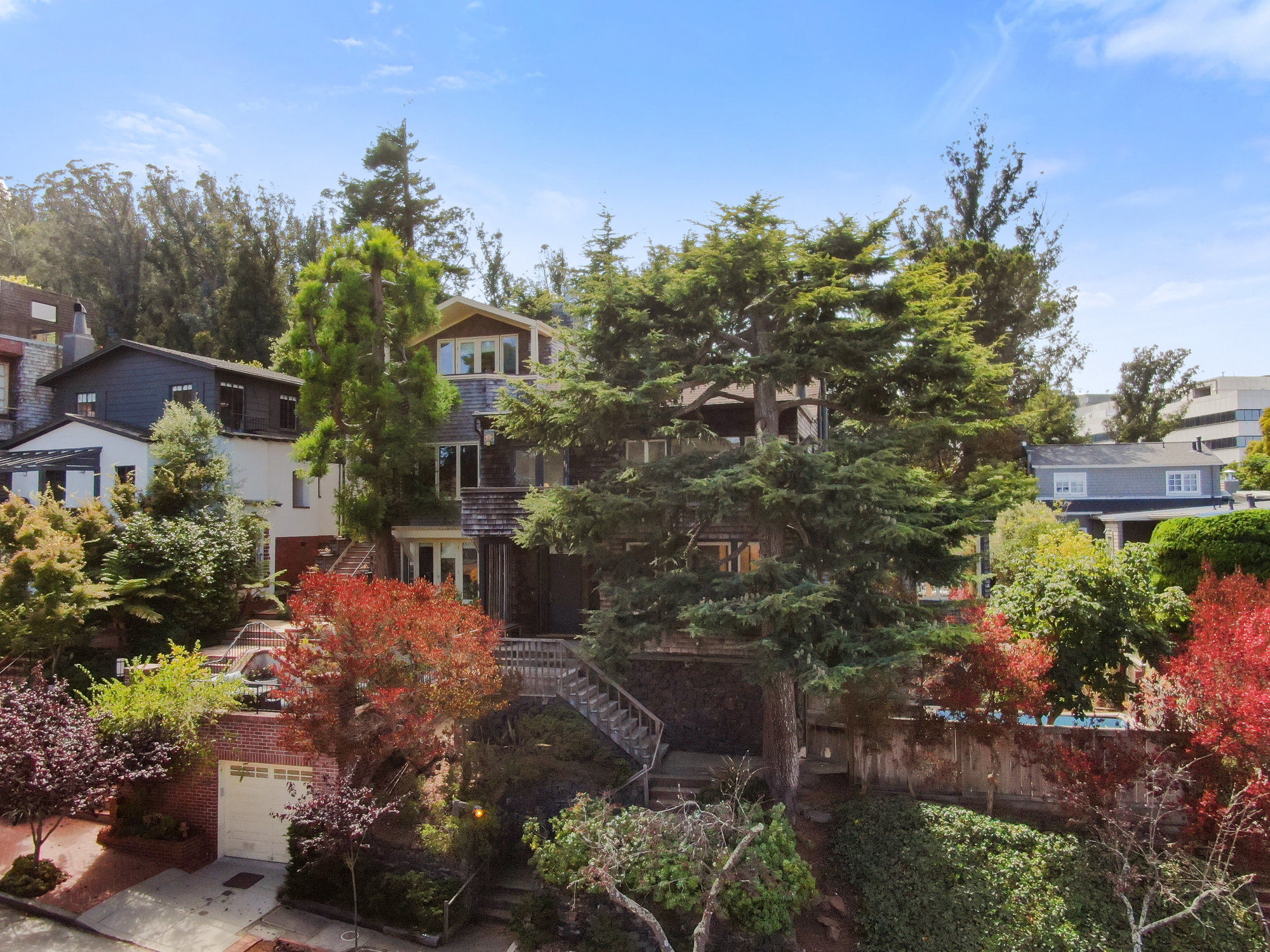 087120 Front facade of 183 Edgewood Avenue, showing a wooded home, sold by John DiDomenico