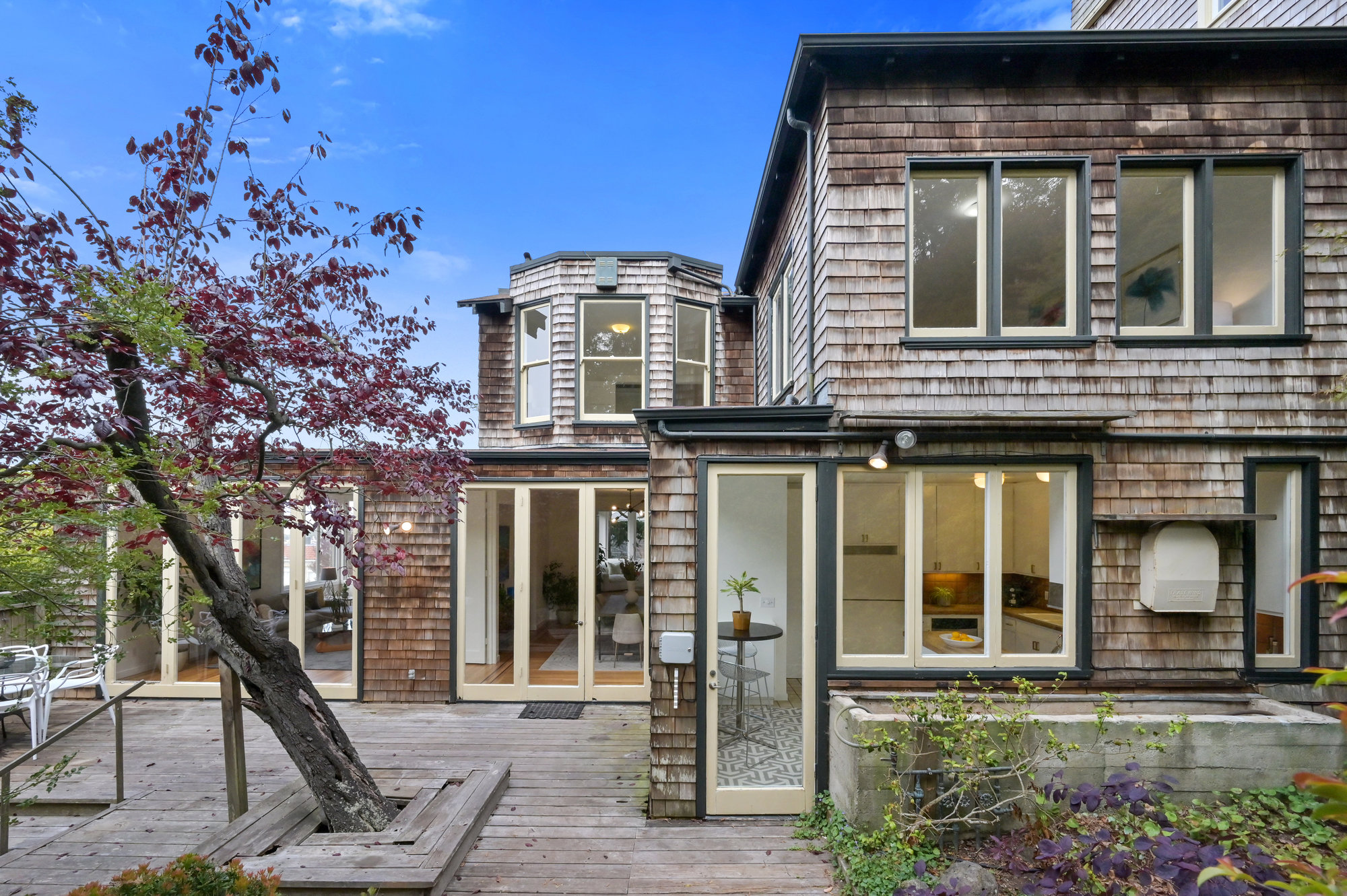 094101 Rear exterior view of 183 Edgewood Avenue, showing a home with wooded facade