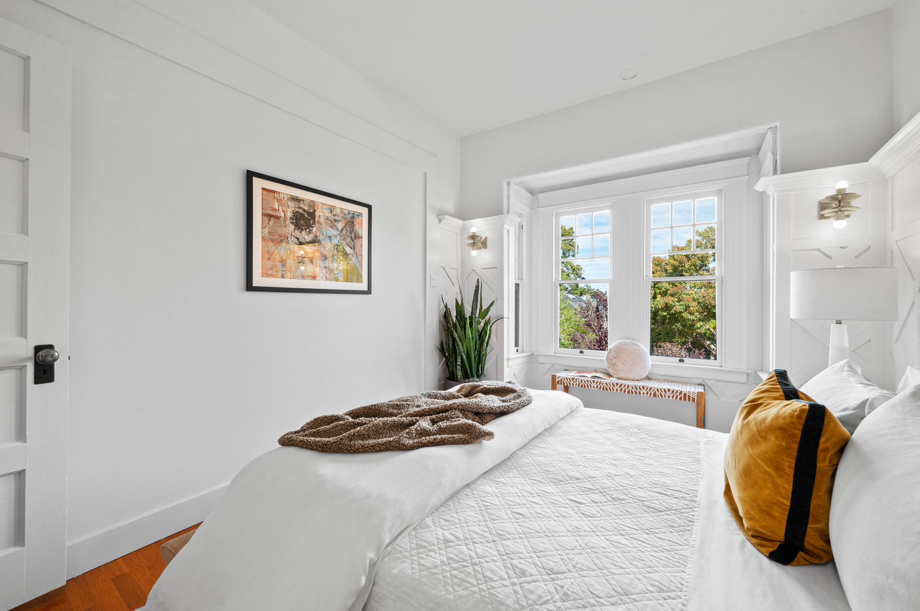 Front bedroom has harwood floors through out and lots of wood detailing on walls.