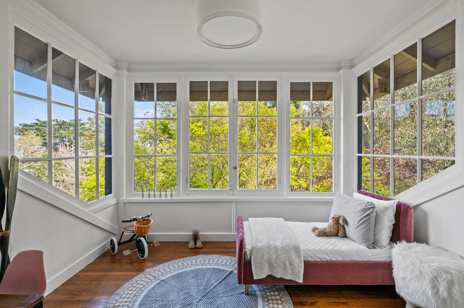 096photos281edgewood073 Guest room has large windows on three sides that look out onto Edgewood.