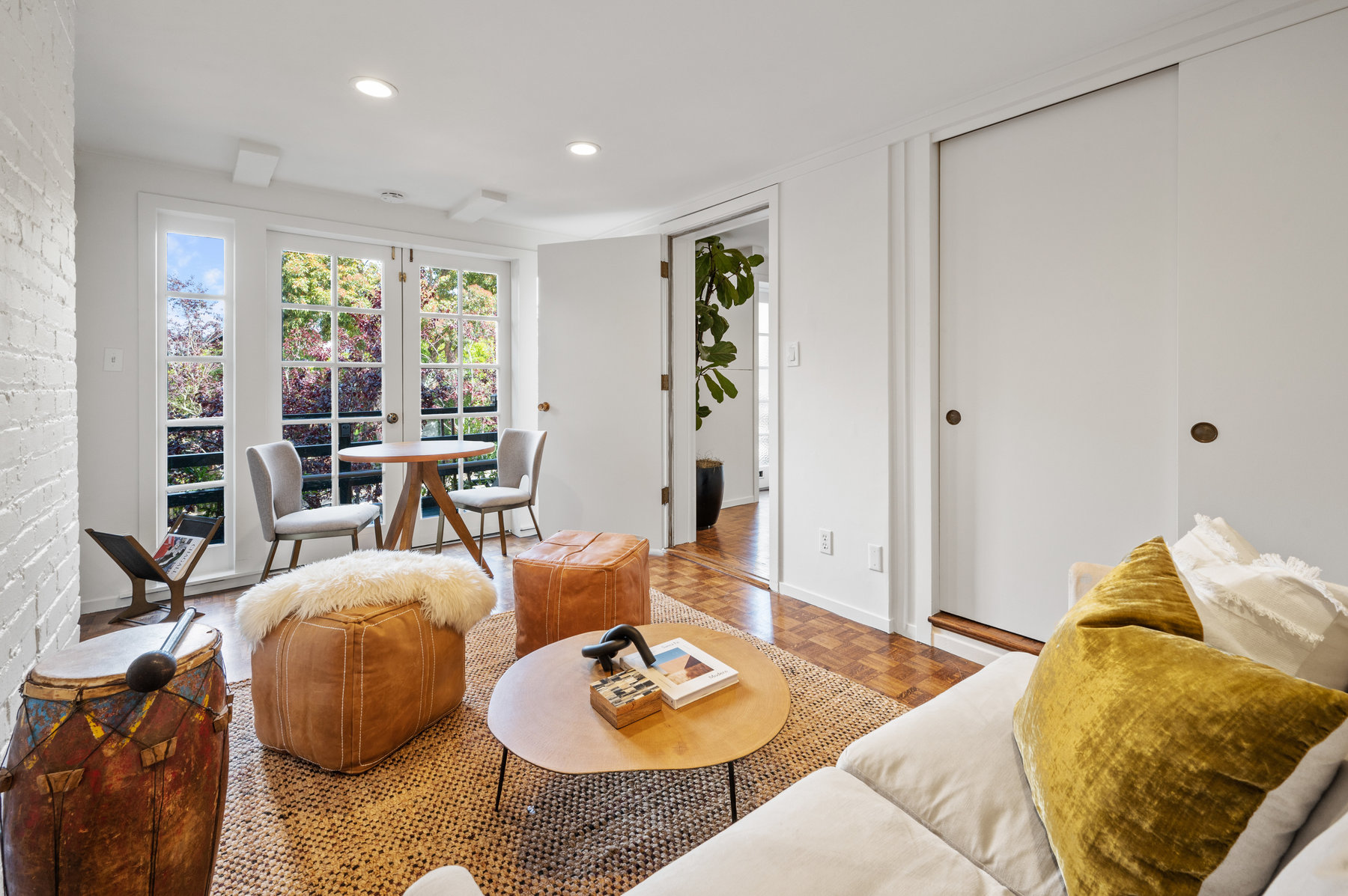 Sitting room on lower bonus lever has french doors that open up to front deck that looks out to Edgewood Ave.