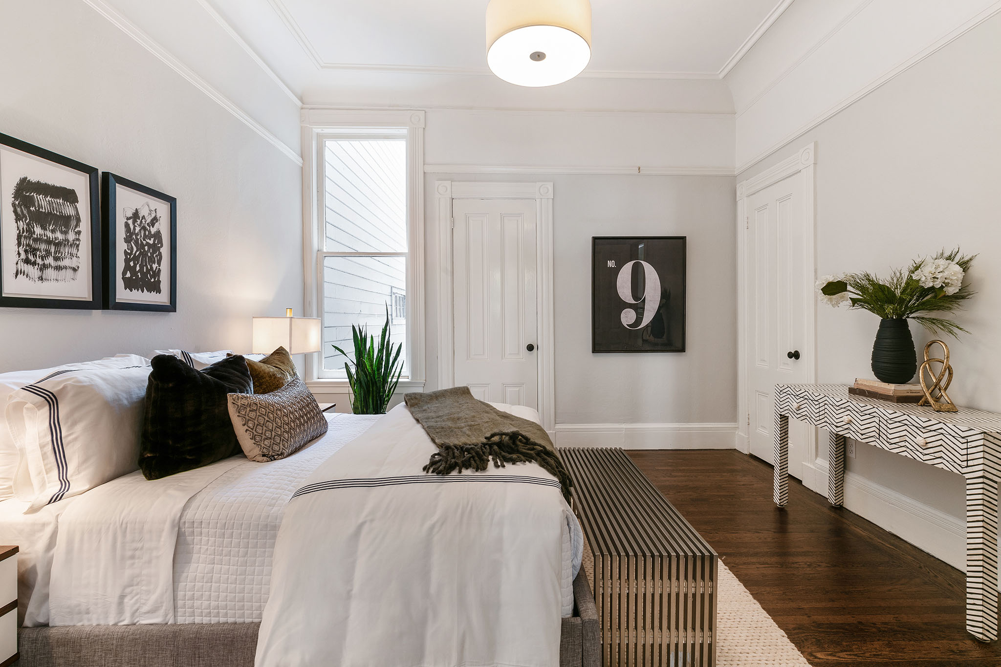 10-1 Bedroom with a window, crown moulding, and wood floors