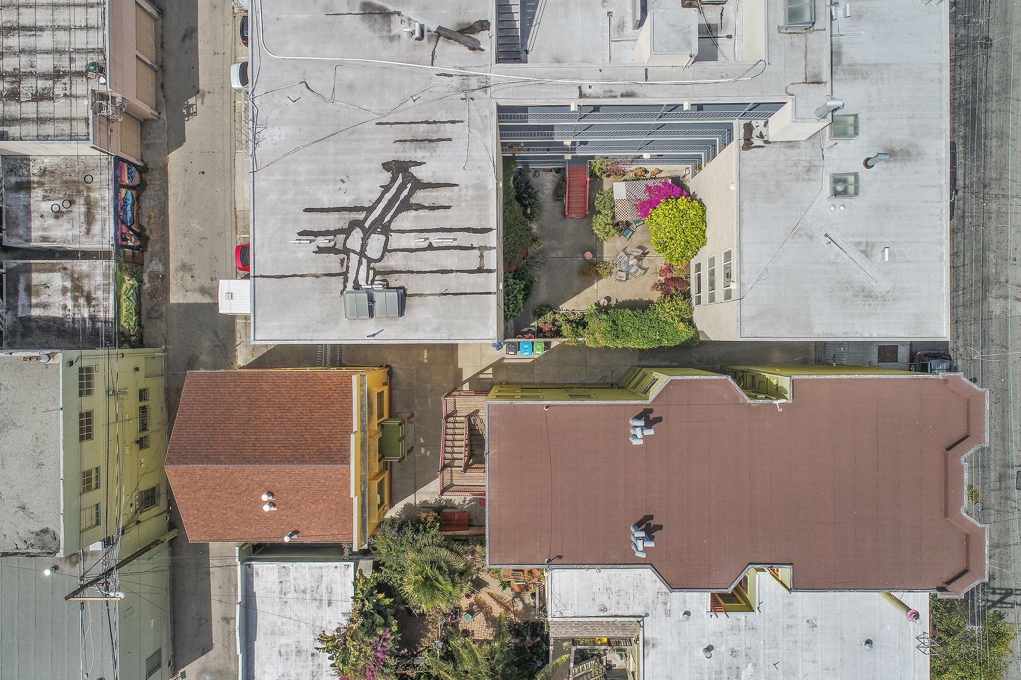 Aerial view looking down at 464-468 Bartlett Street, showing a larger property to the right, and a smaller stand-along property to the left