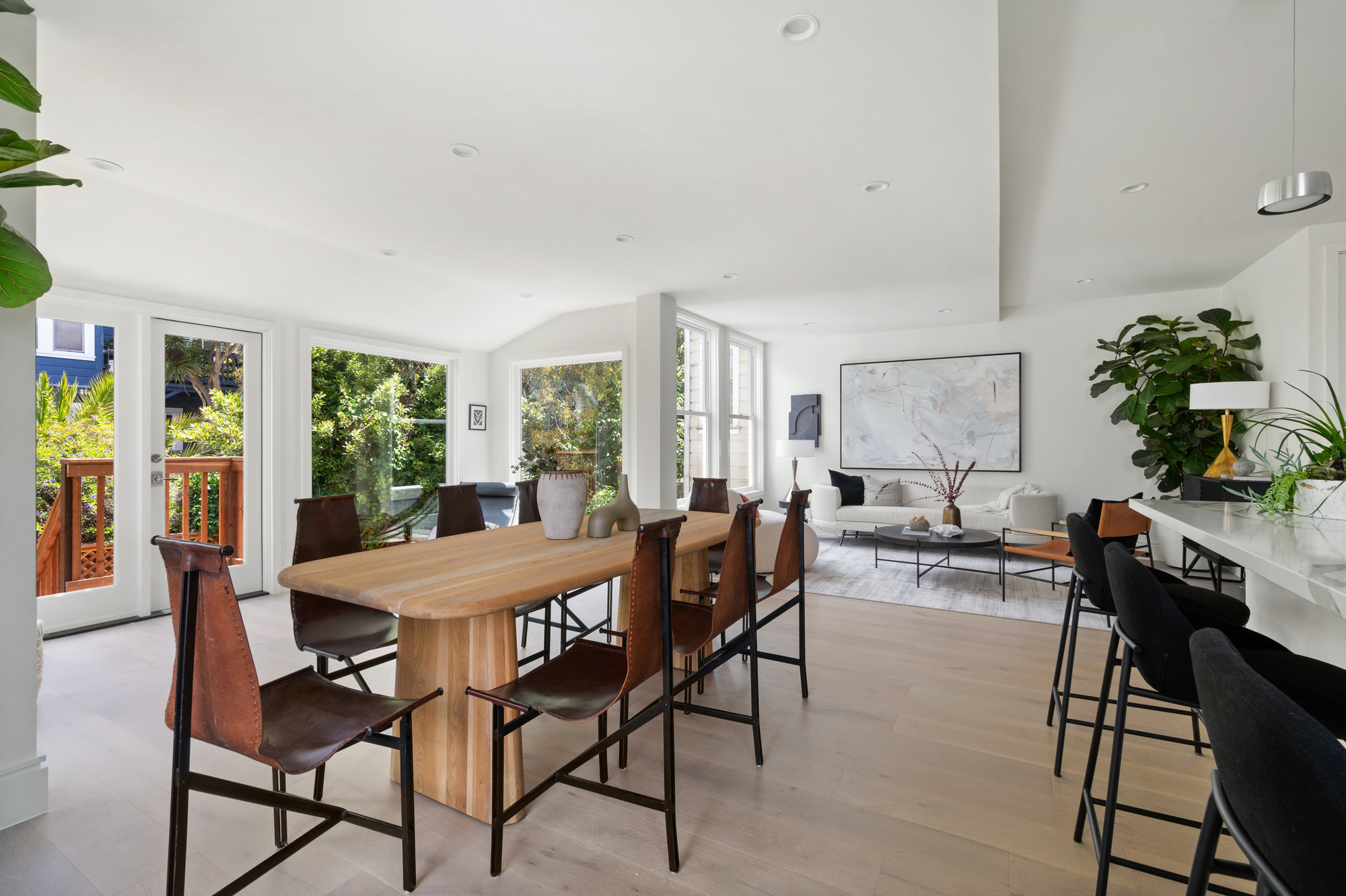 Looking at kitchen table and island to the right.