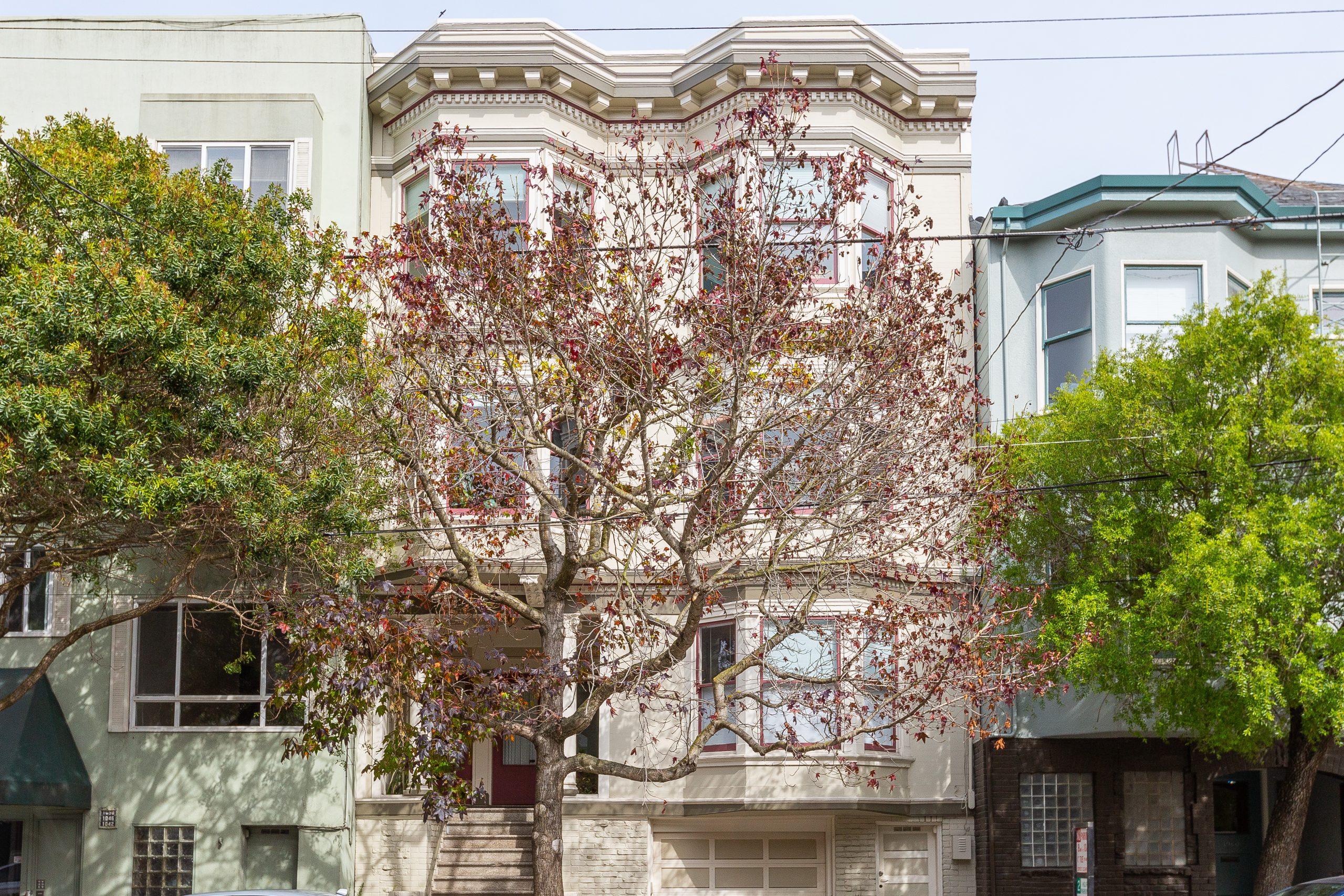 Front exterior view of 1052 Cole Street, featuring a tan facade