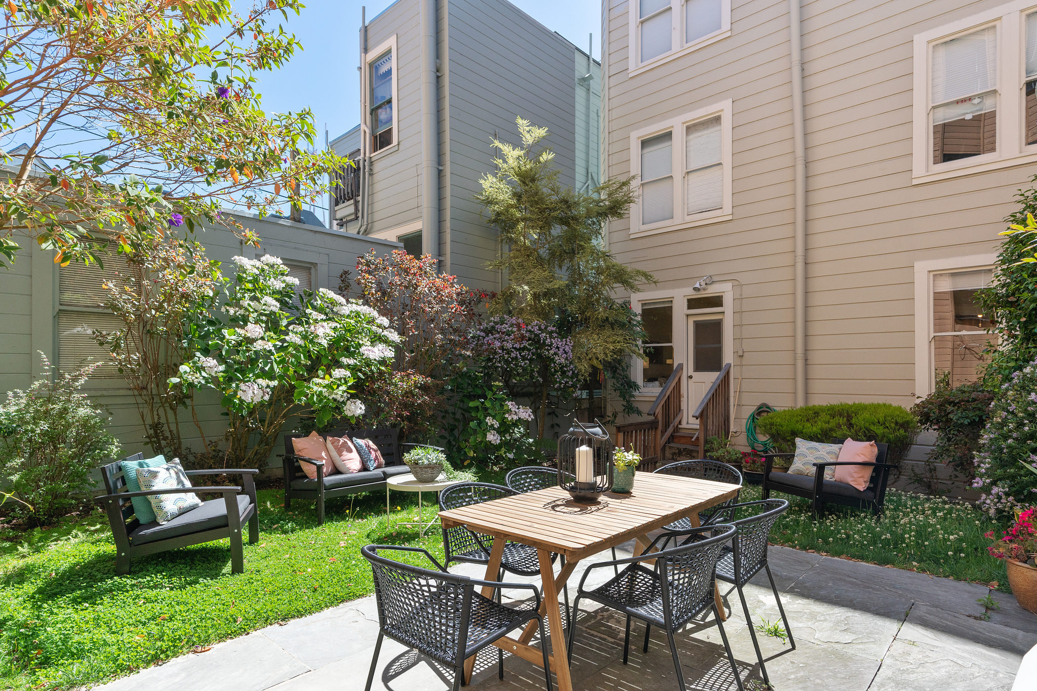 View of the out door living space, featuring a table and patio