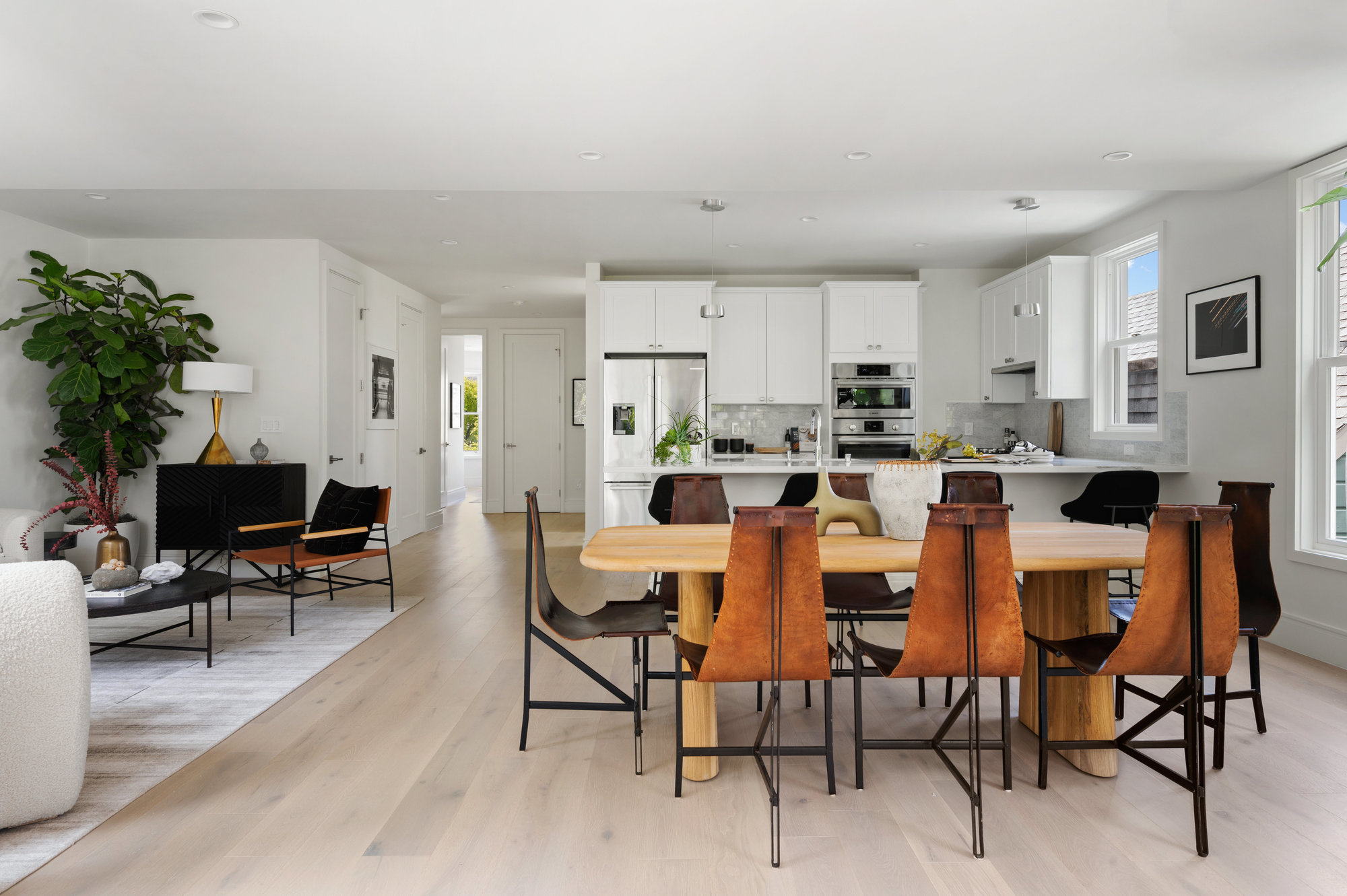 Looking at dining area with the kitchen in the back round.