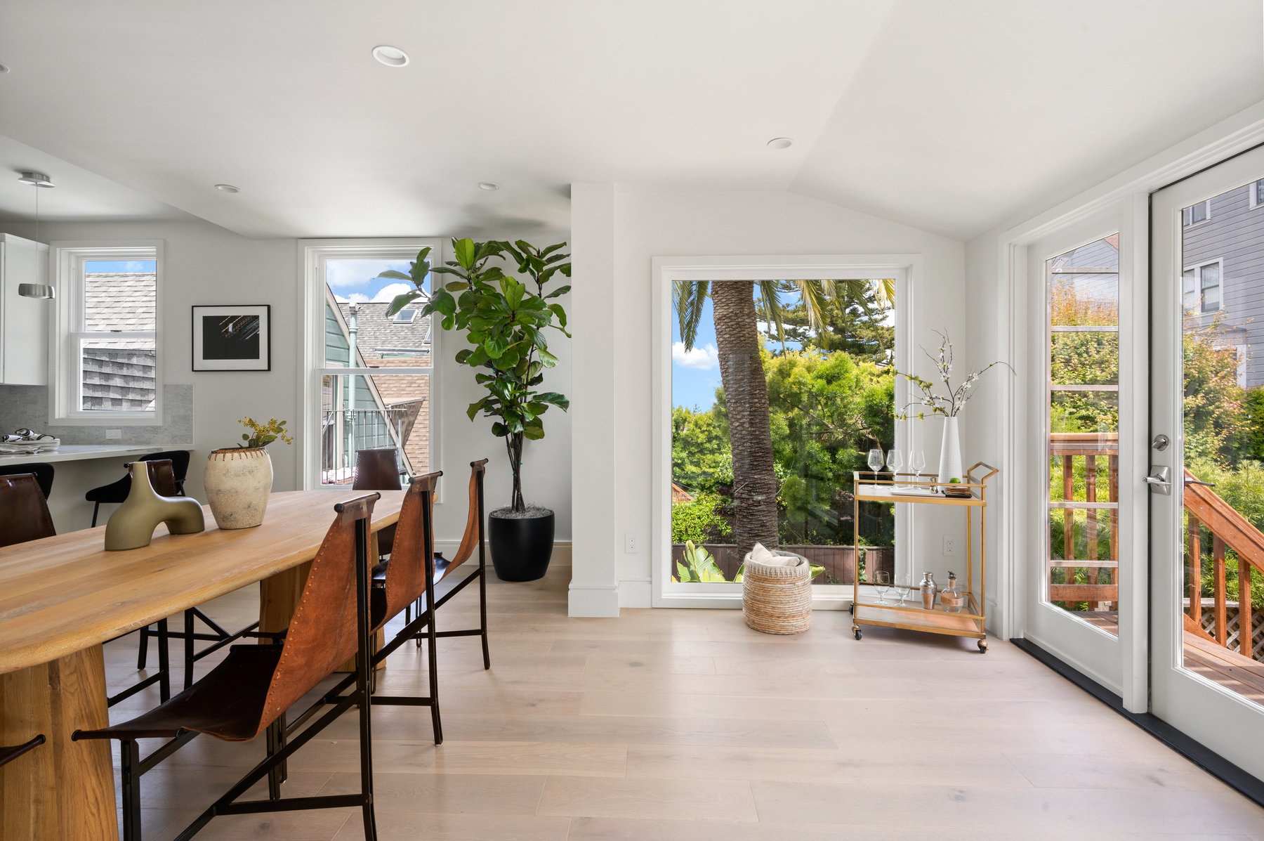 Dining area with large windows and French doors leading out