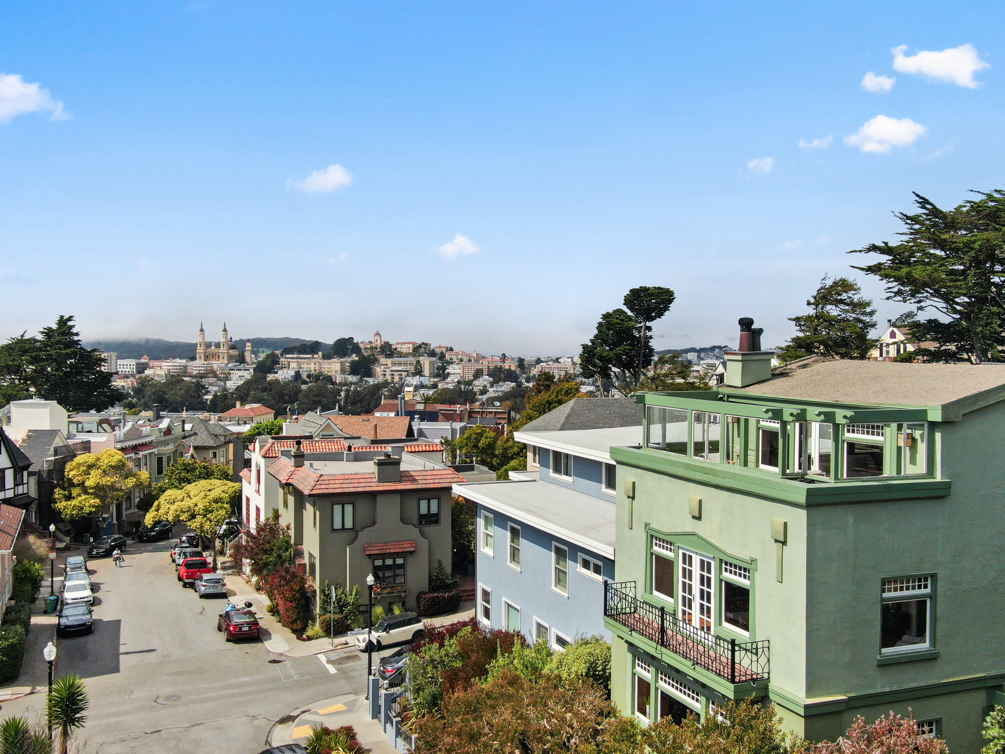 Street view of 4 Ashbury Terrace, showing the large homes lining the streets in the Ashbury Heights neighborhood